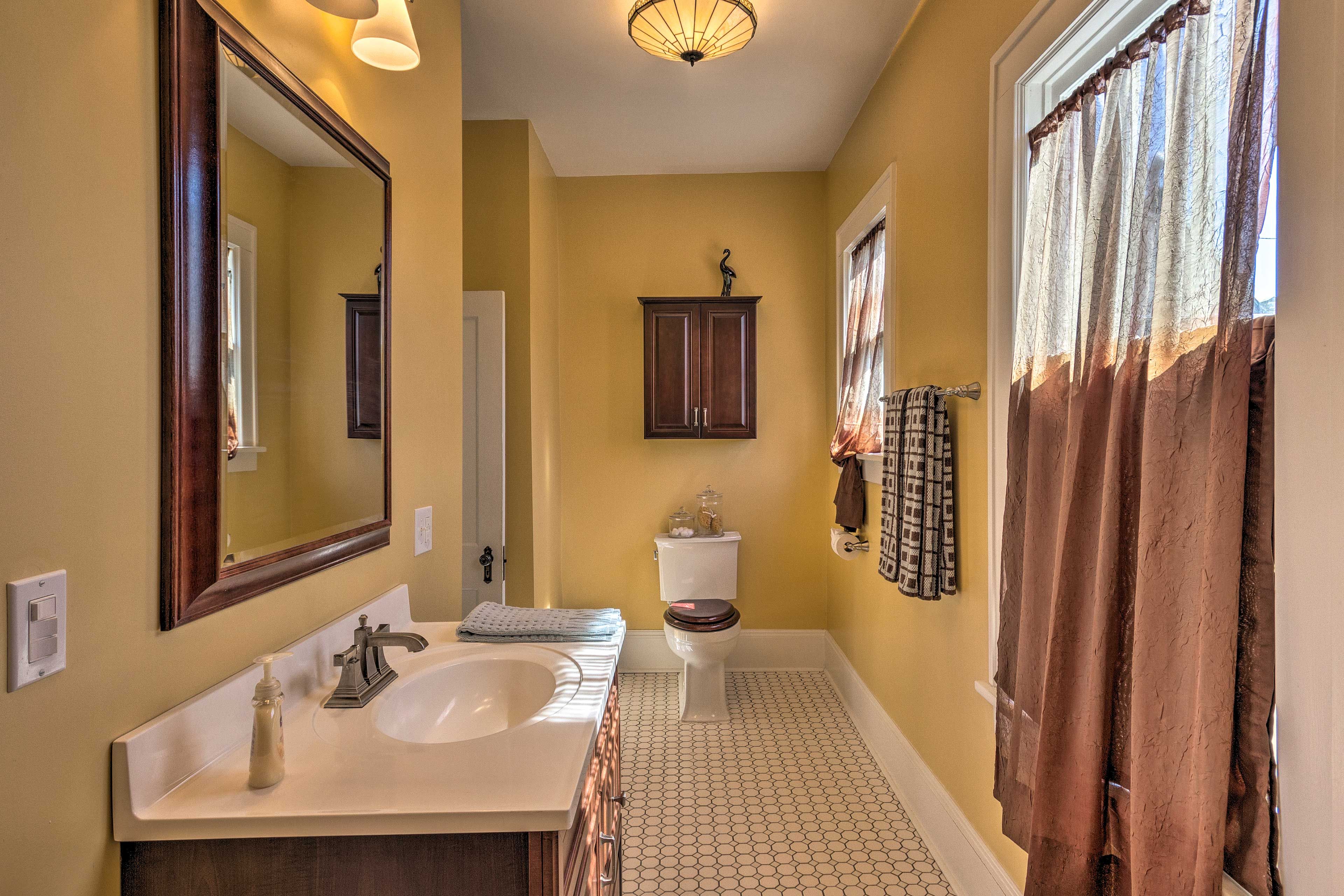 Get ready for the day in the full bathroom.