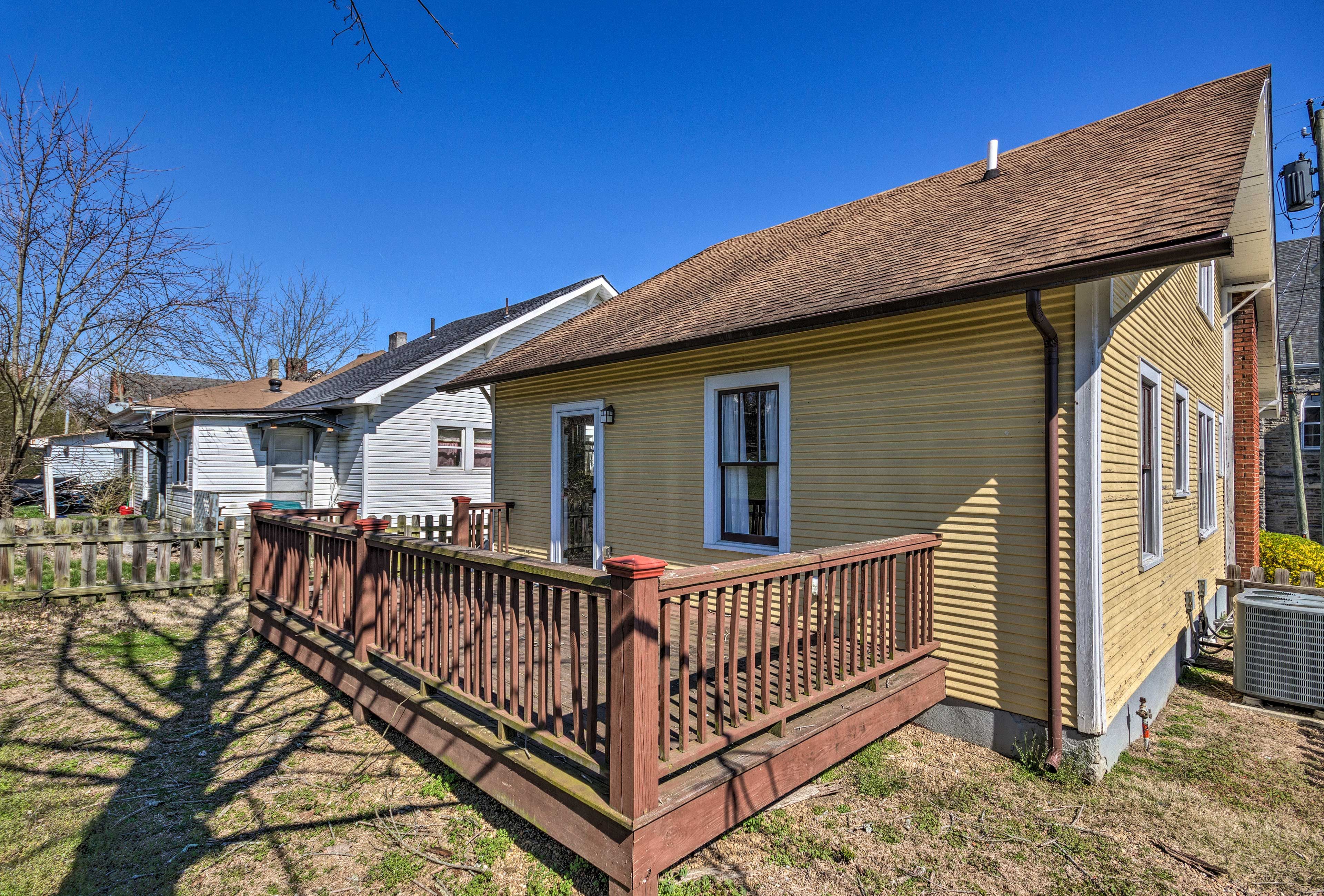 The backyard is fenced-in and has a spacious deck.