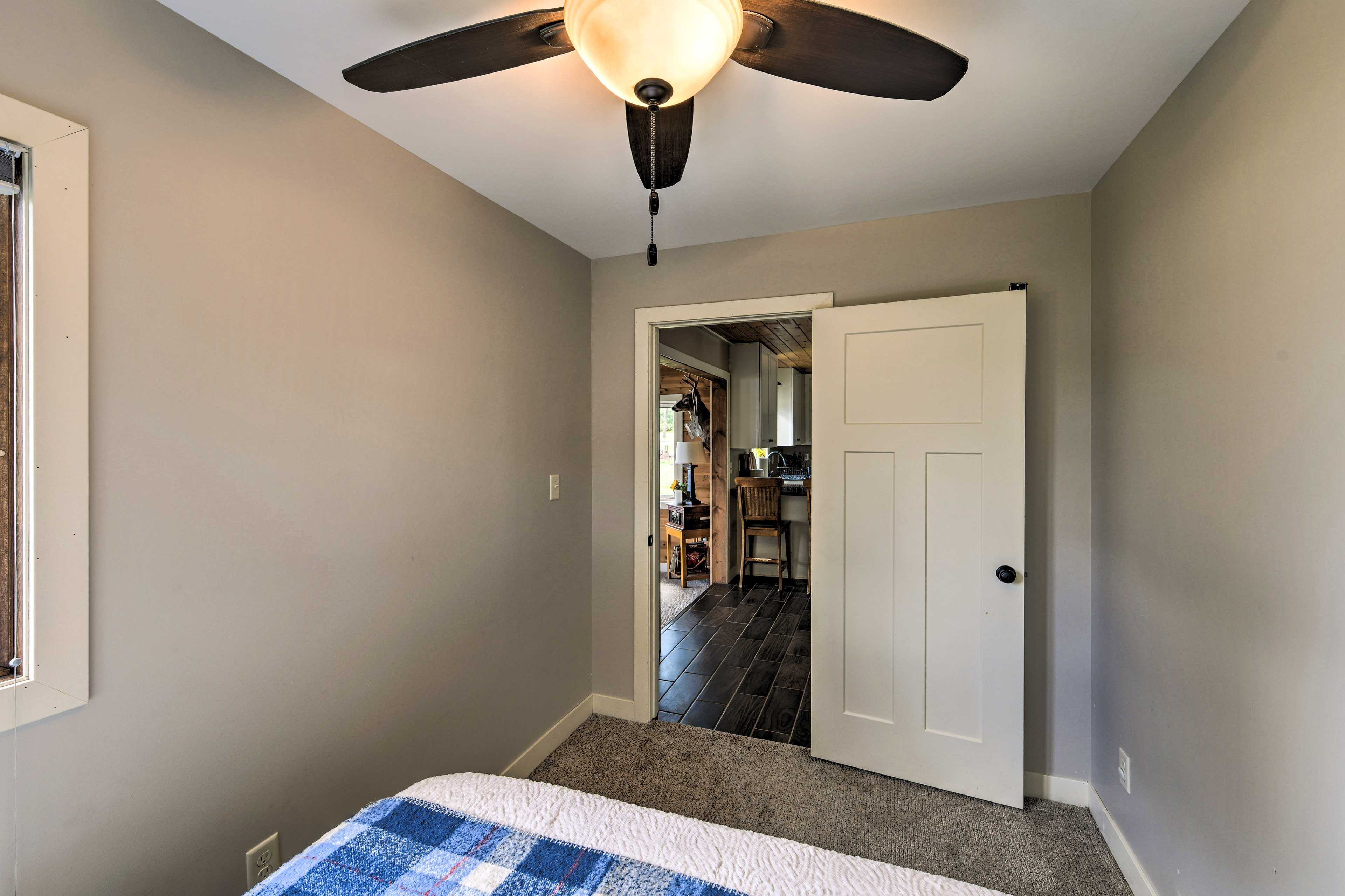 Bedroom 1 is outfitted with a comfortable queen.
