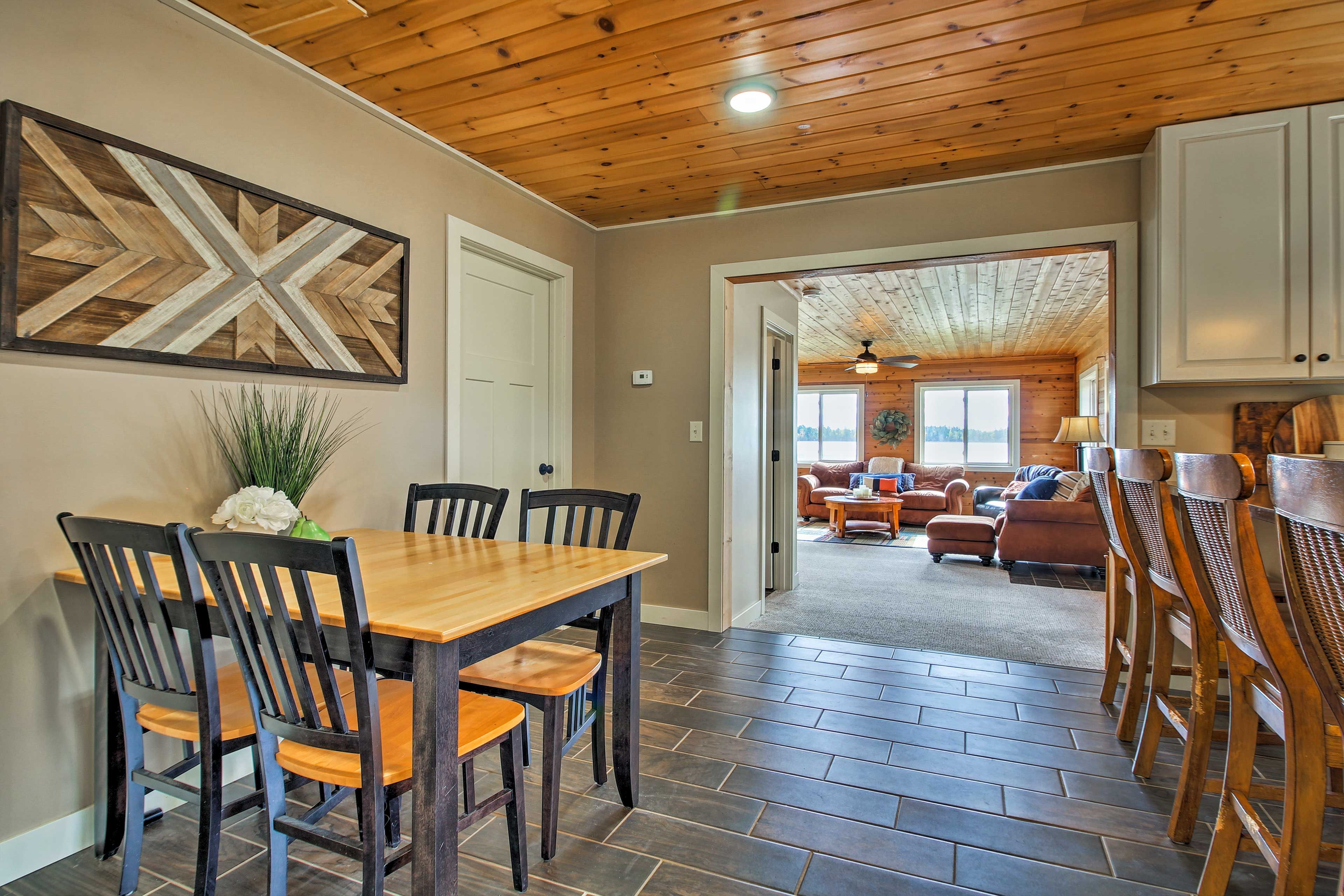 Gather the group for a family dinner around the dining table.