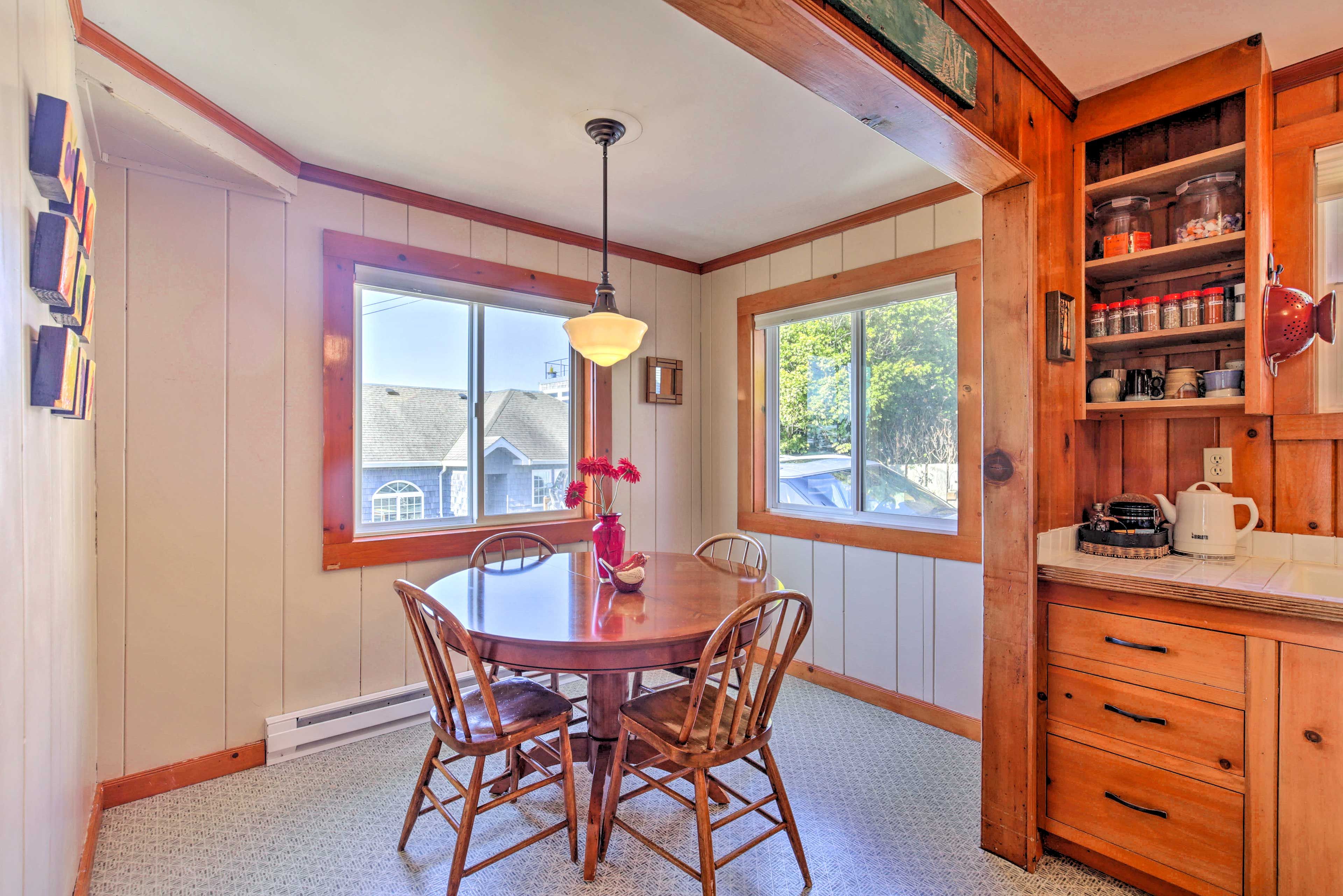 Enjoy home-cooked meals at the dining table set for 4.