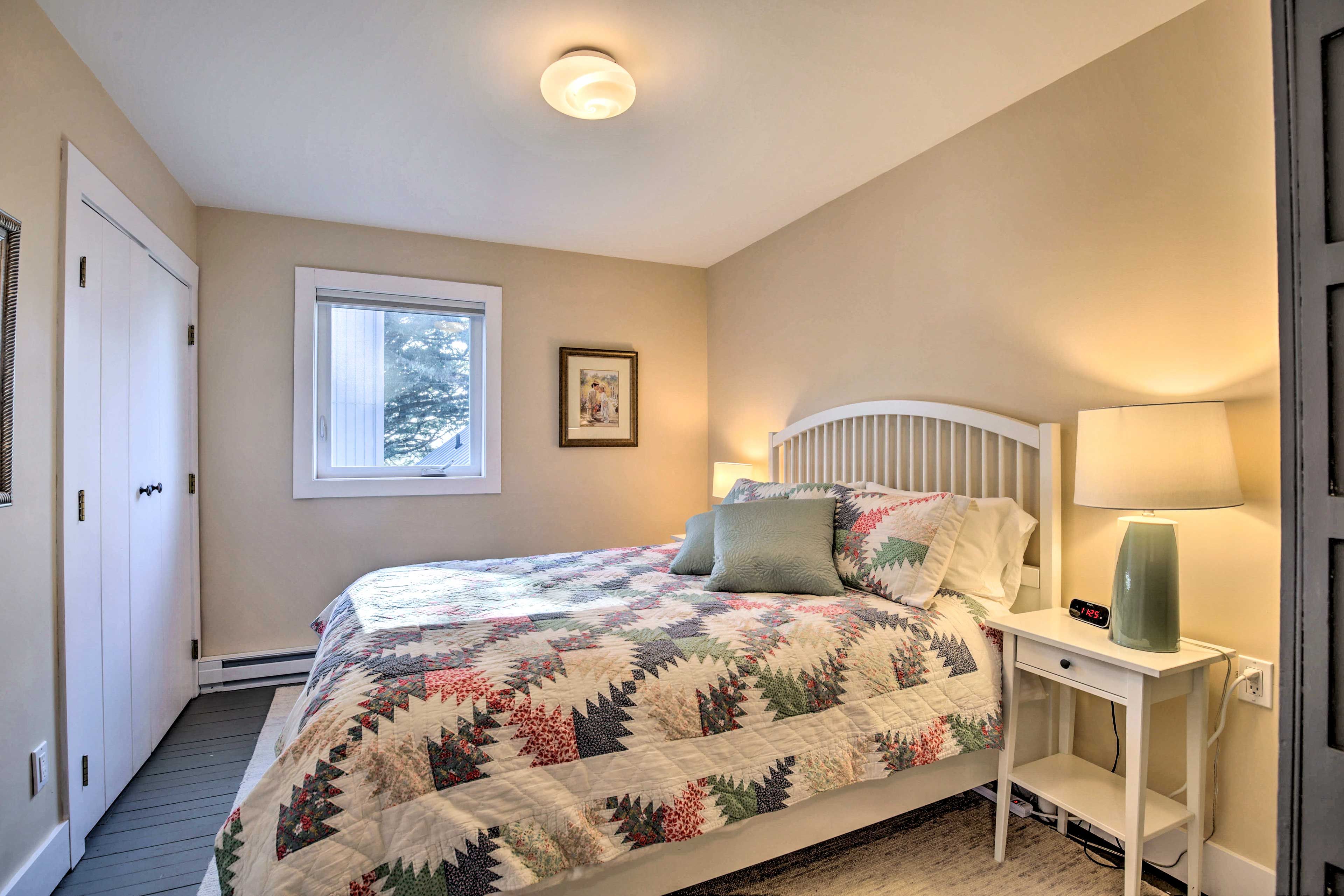 This bedroom features a queen-sized bed.