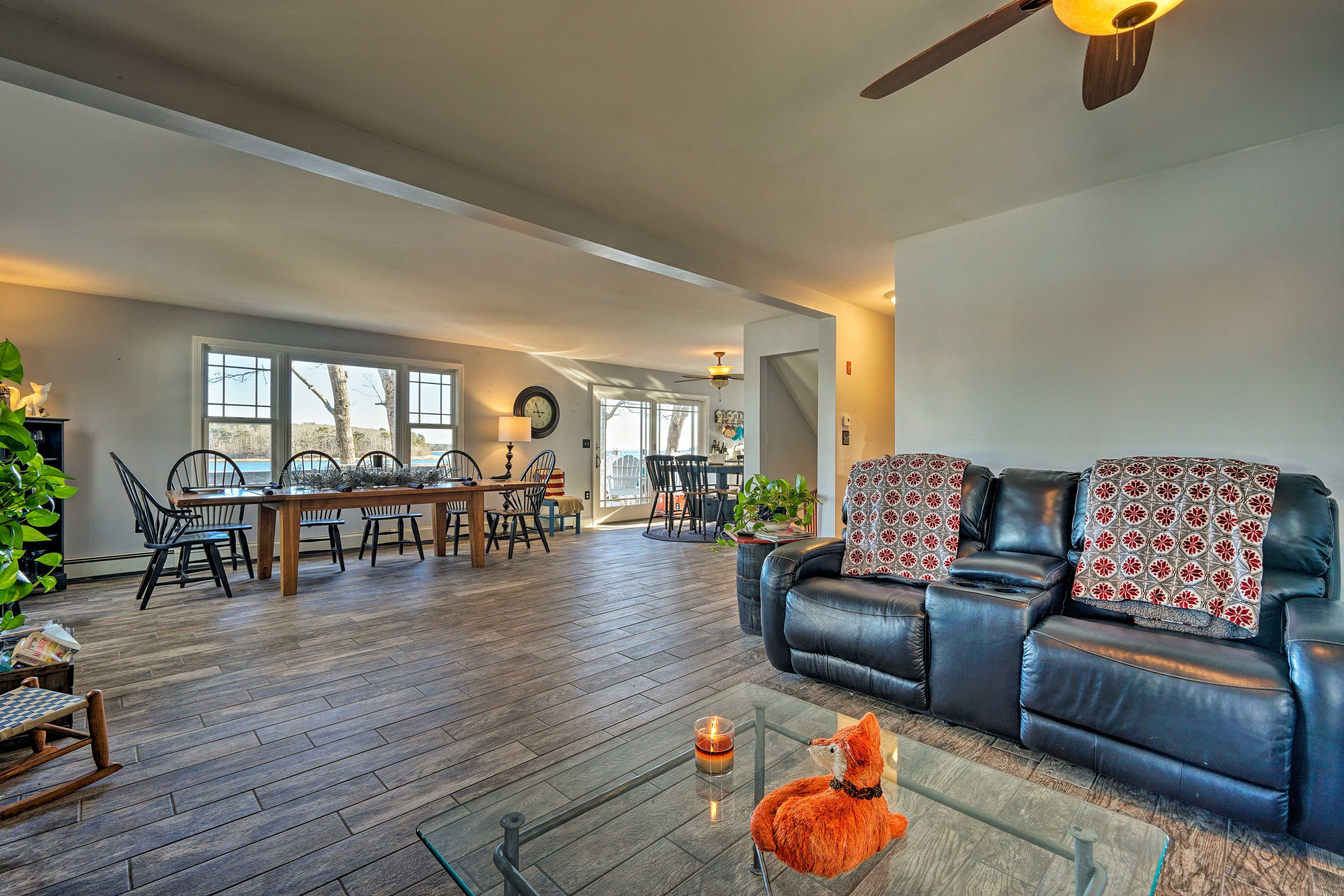 The living room opens into a dining and kitchen area.