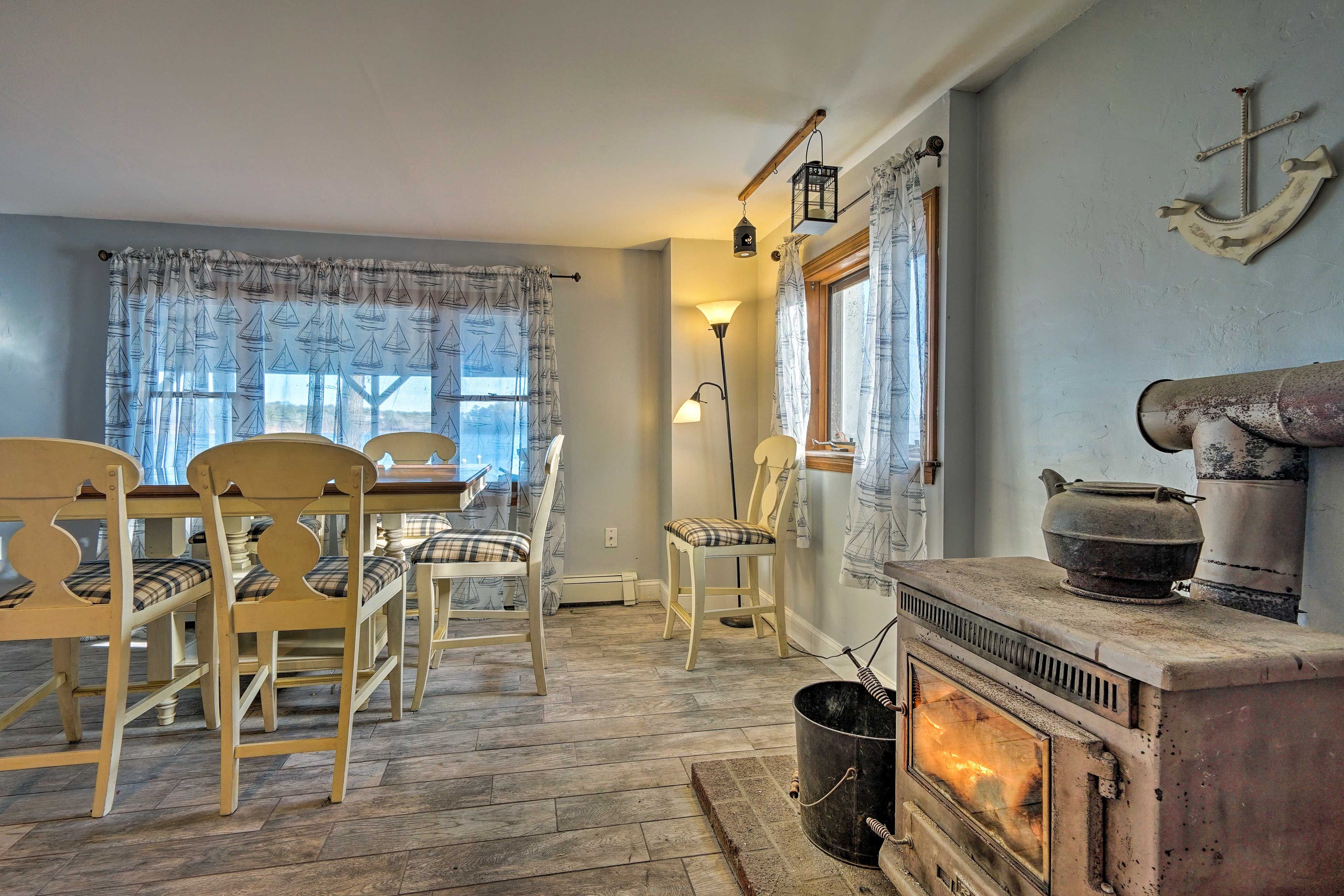 The second dining area features an antique wood stove.