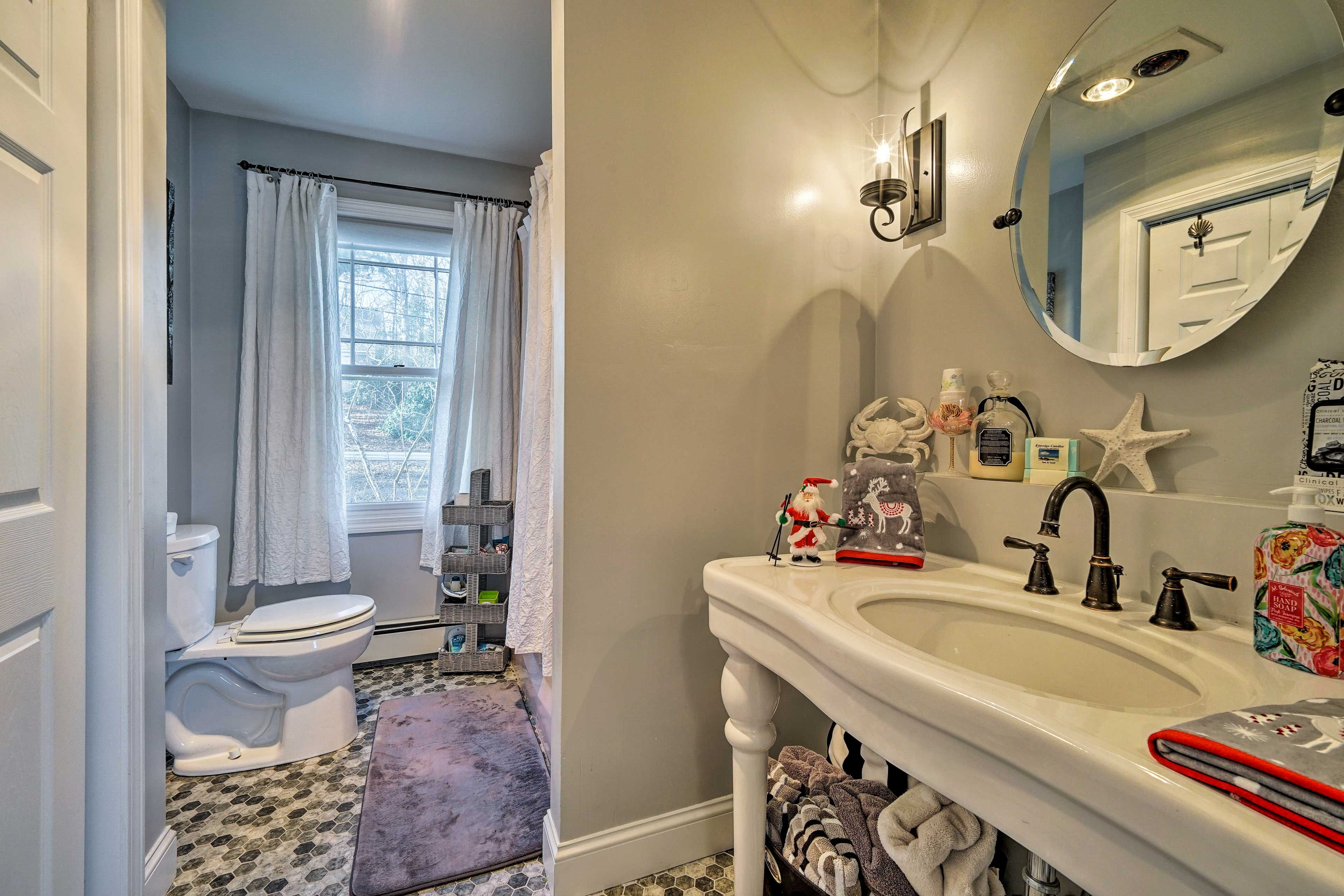 The first bathroom boasts a shower/tub combo.