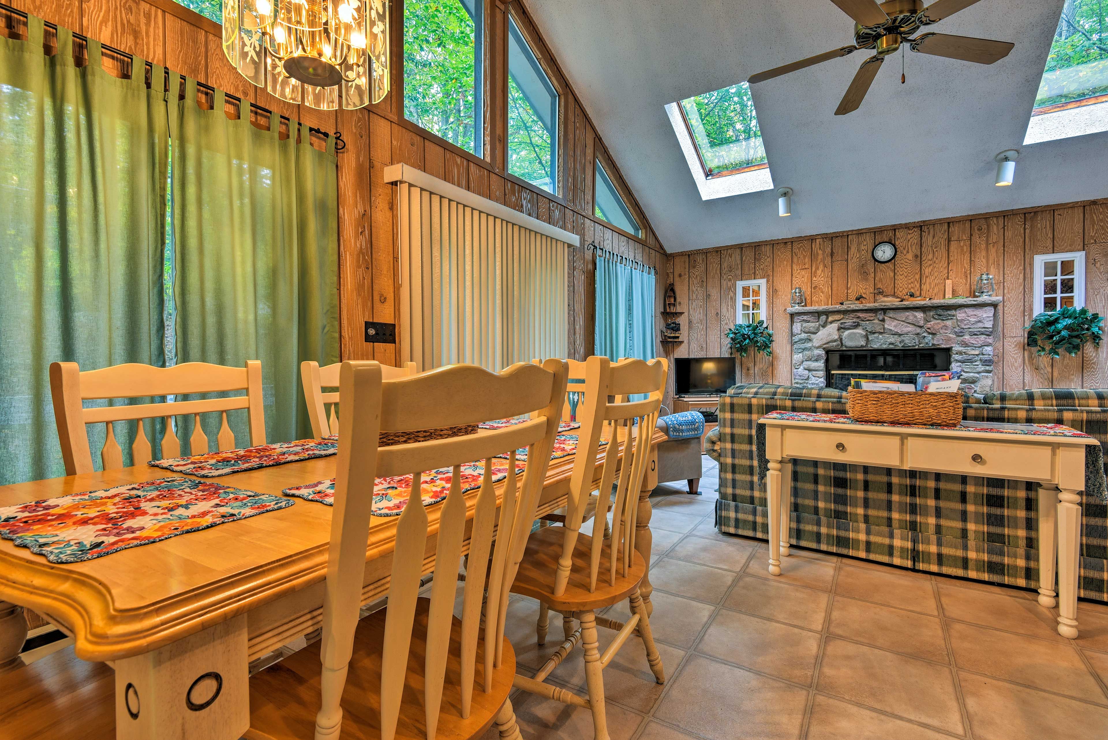 The dining area, kitchen, & living room span across an open floor plan.
