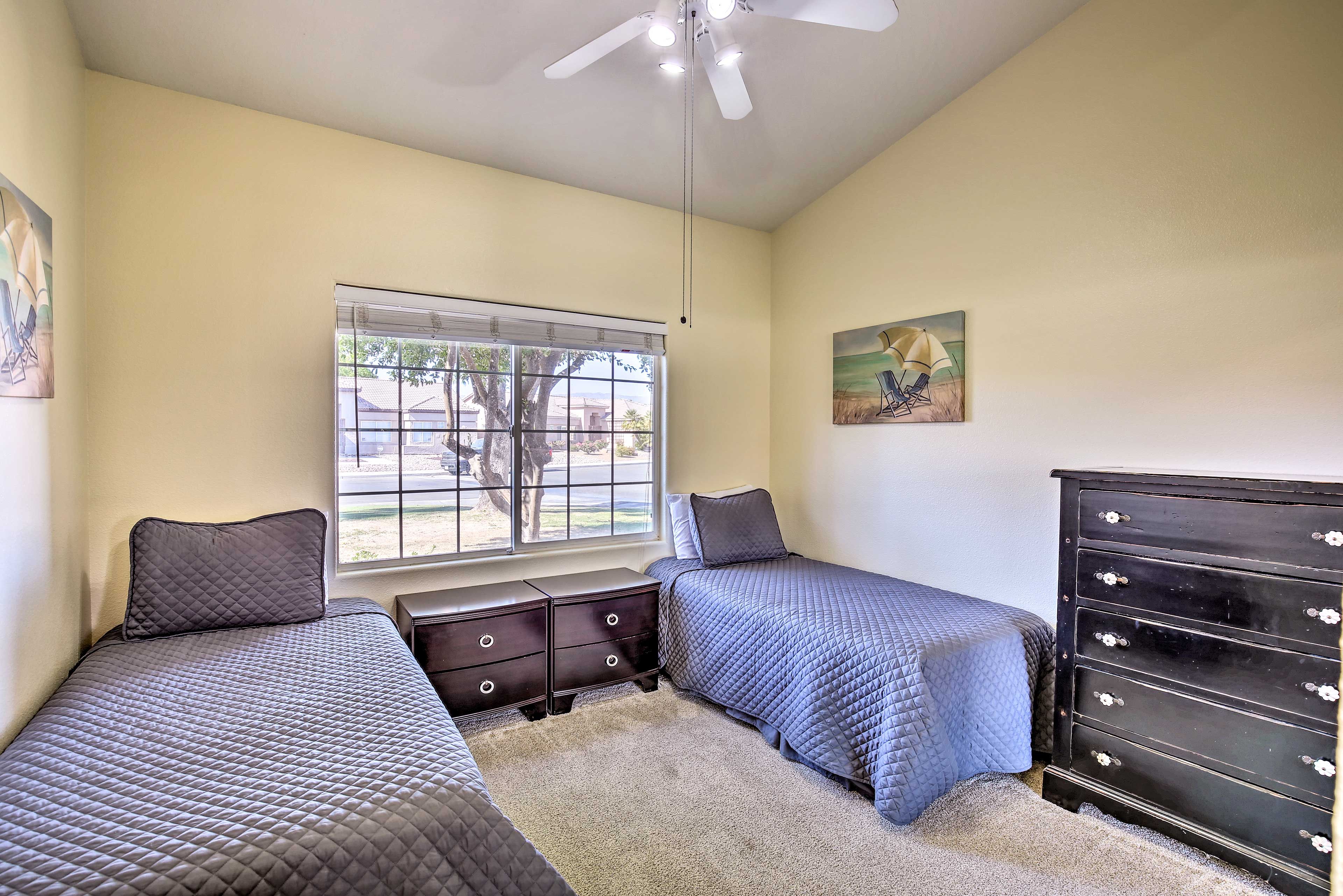 Kids can head to this bedroom featuring 2 twin beds.
