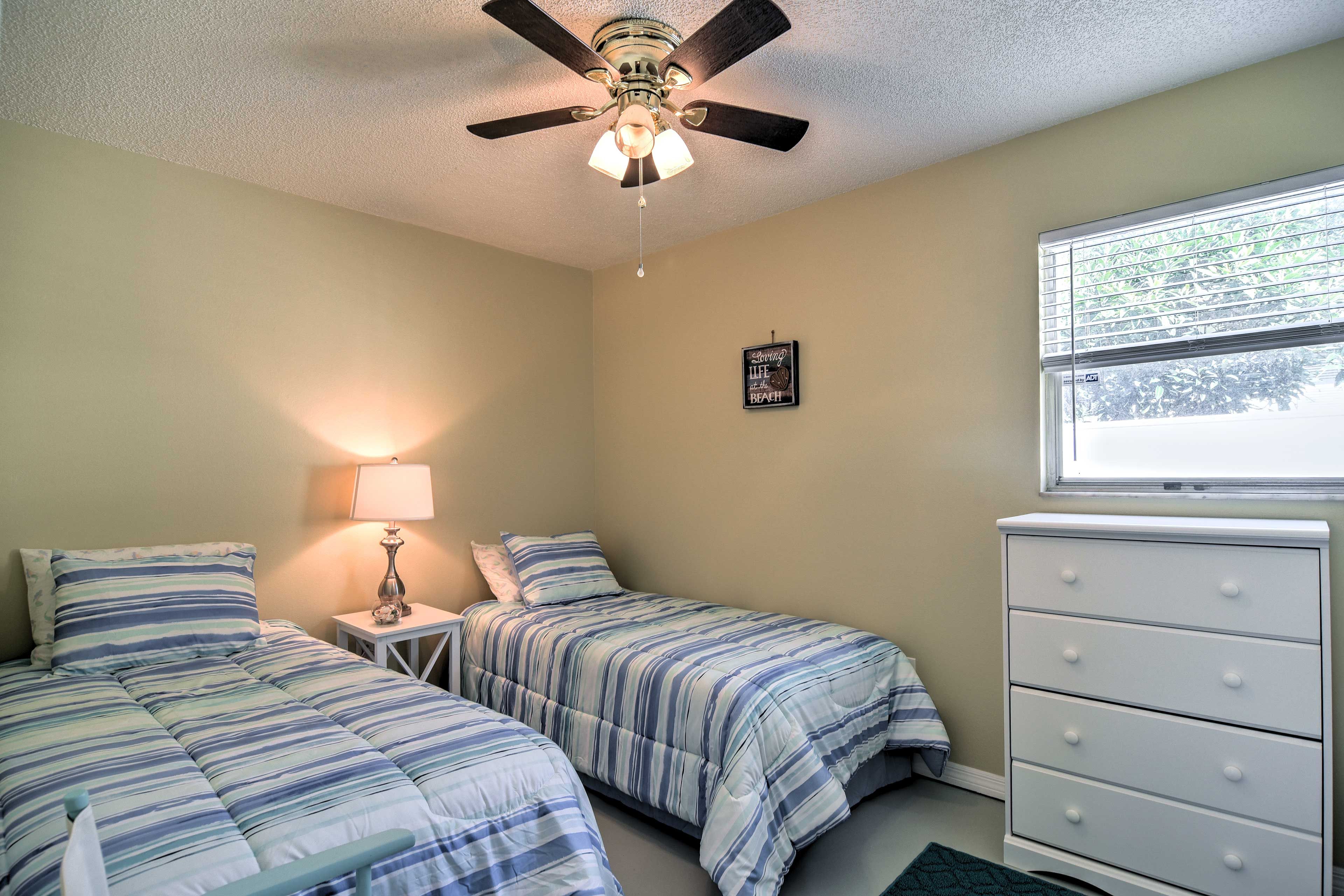 Sleep side by side in these cute twin beds.