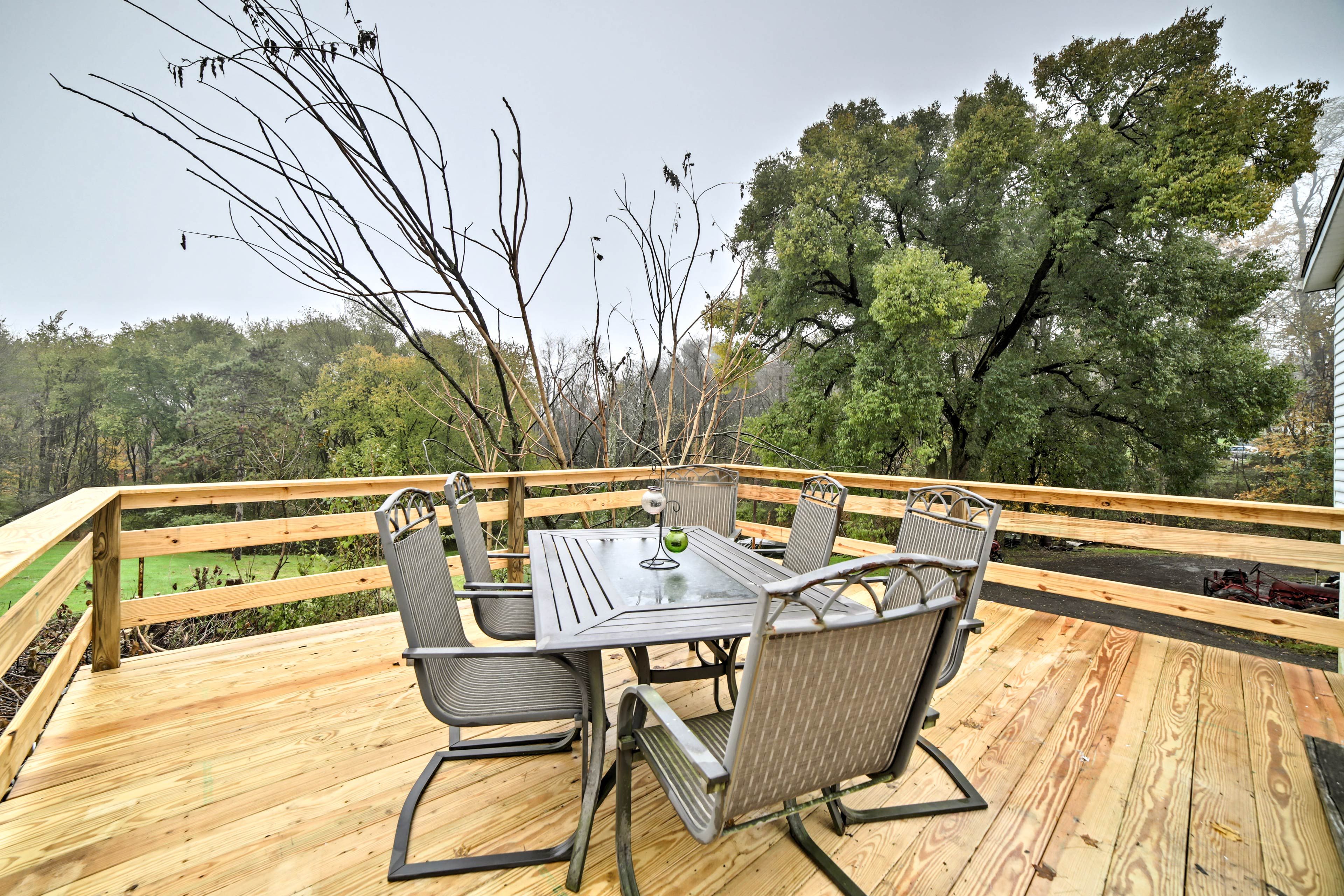 The vacation rental home boasts lush views and a brand new deck!