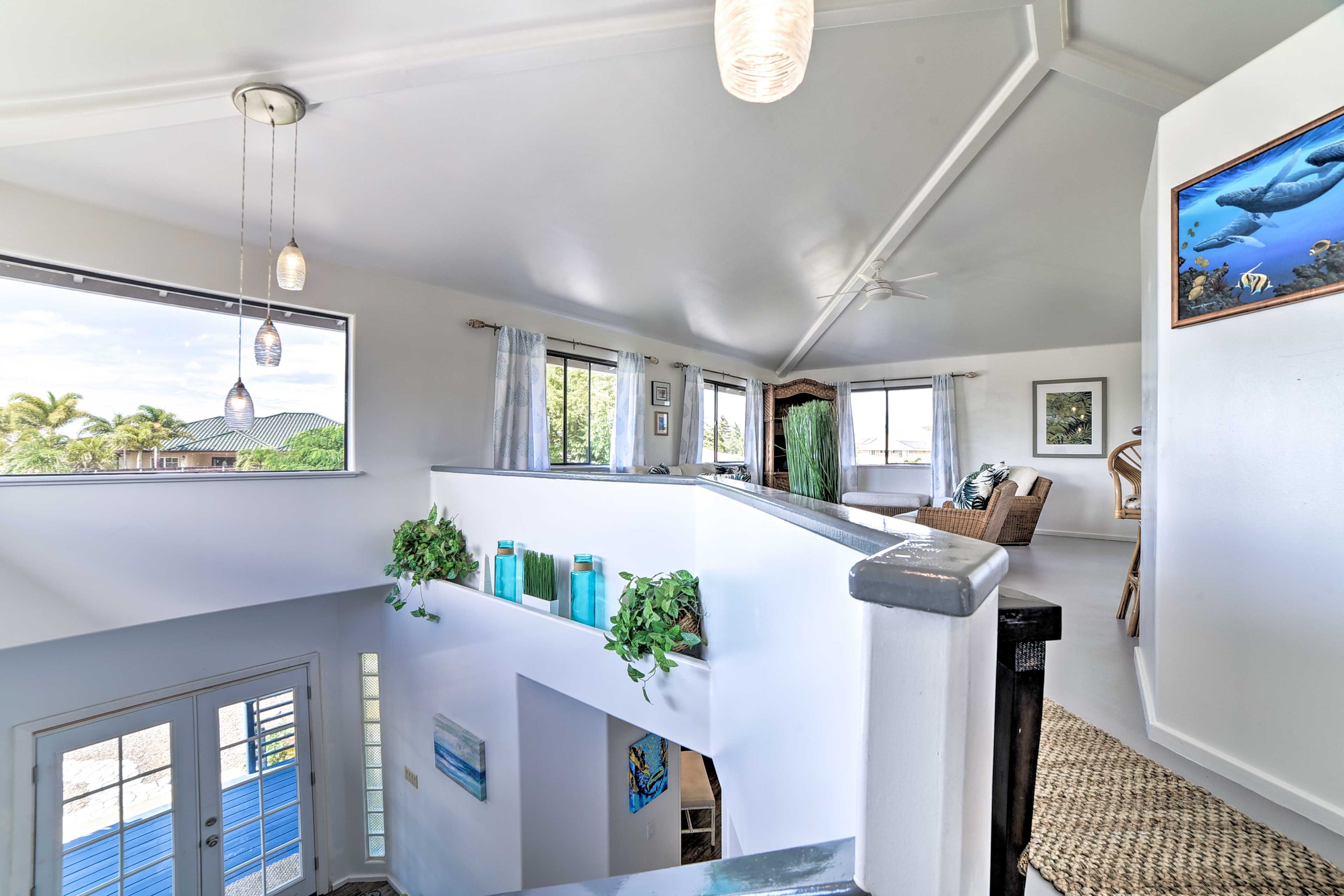 This home is highlighted by a wealth of windows and bright island decor!
