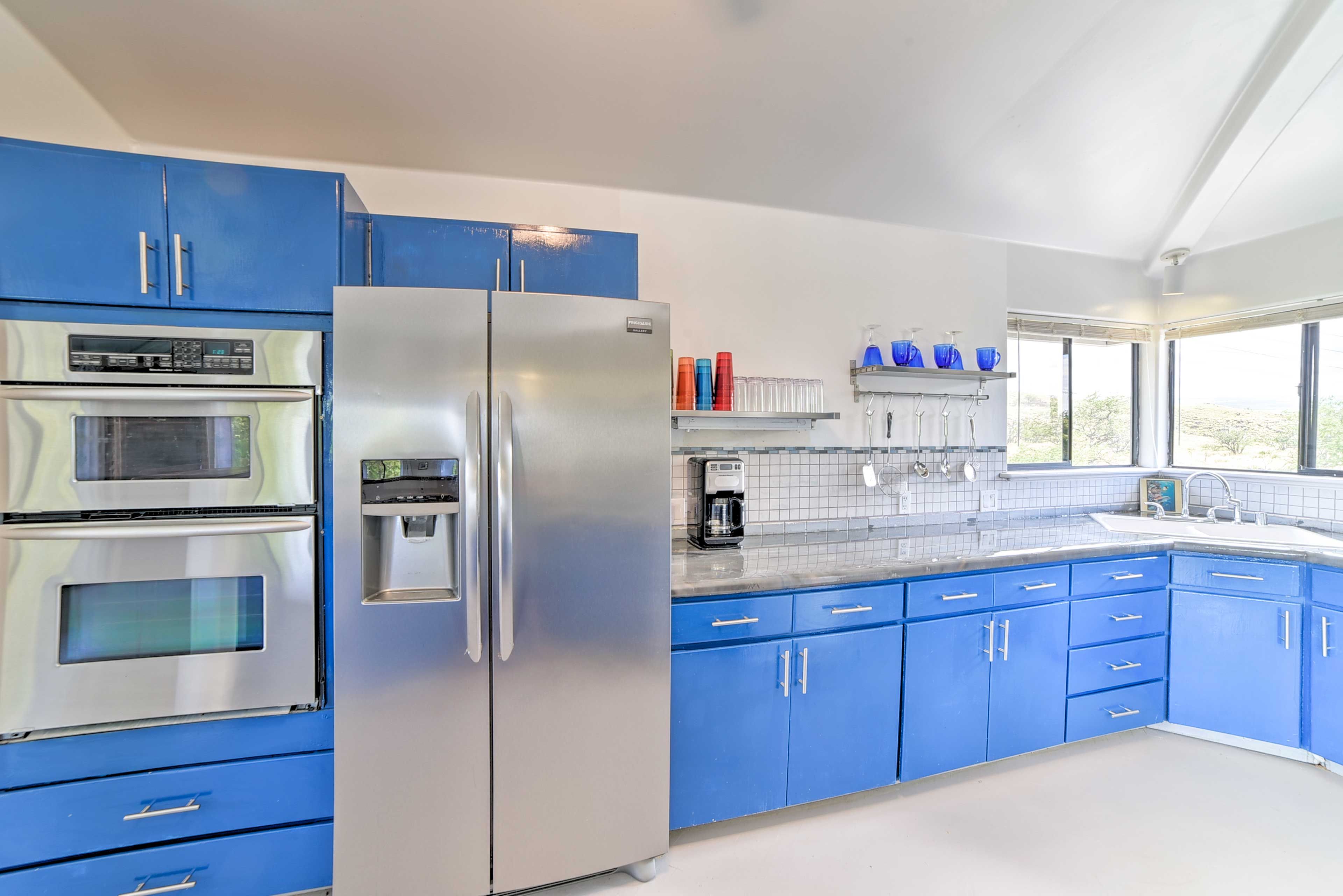 Stainless steel appliances and granite countertops elevate this kitchen.