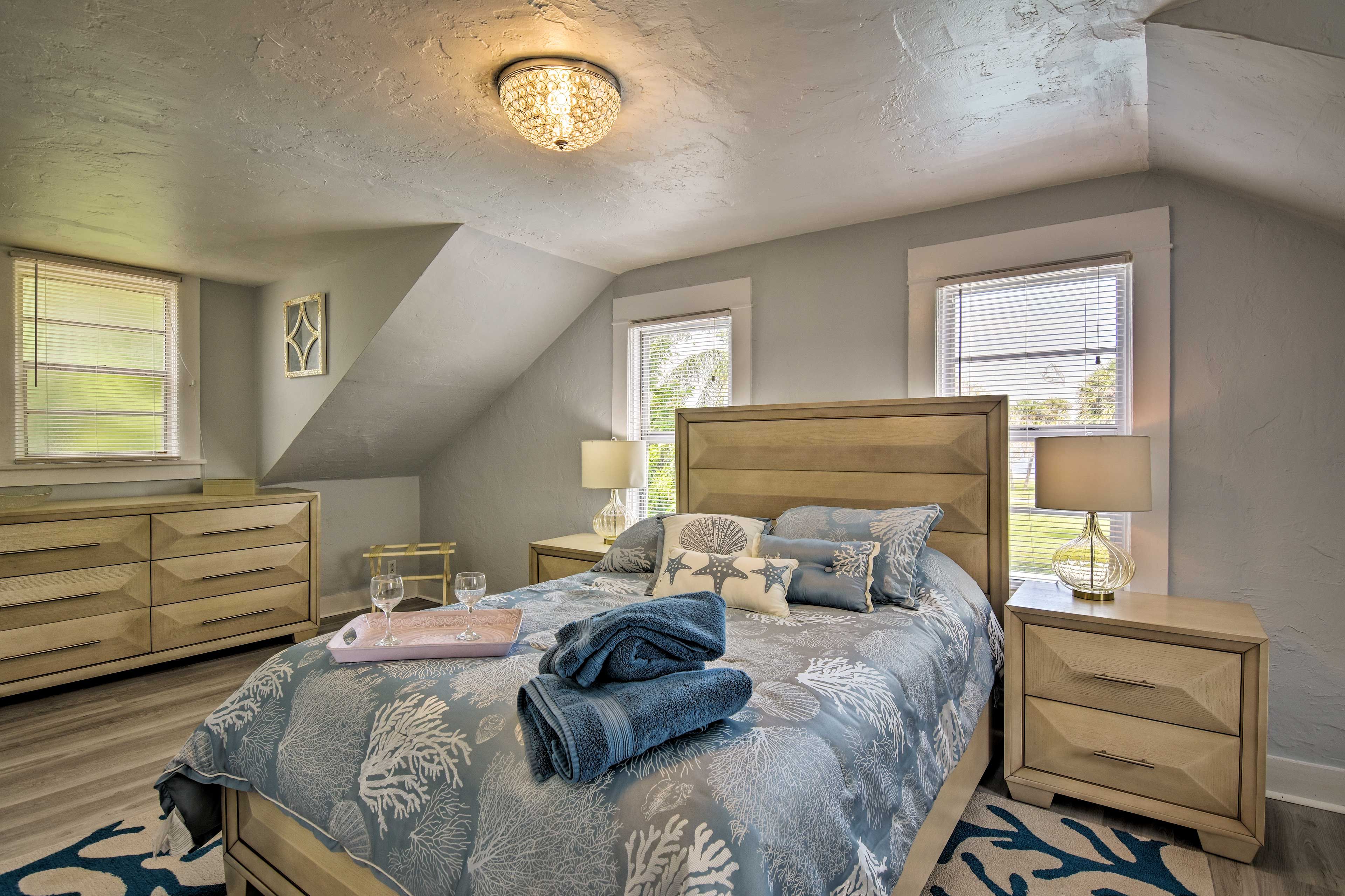 The first bedroom features a queen bed.
