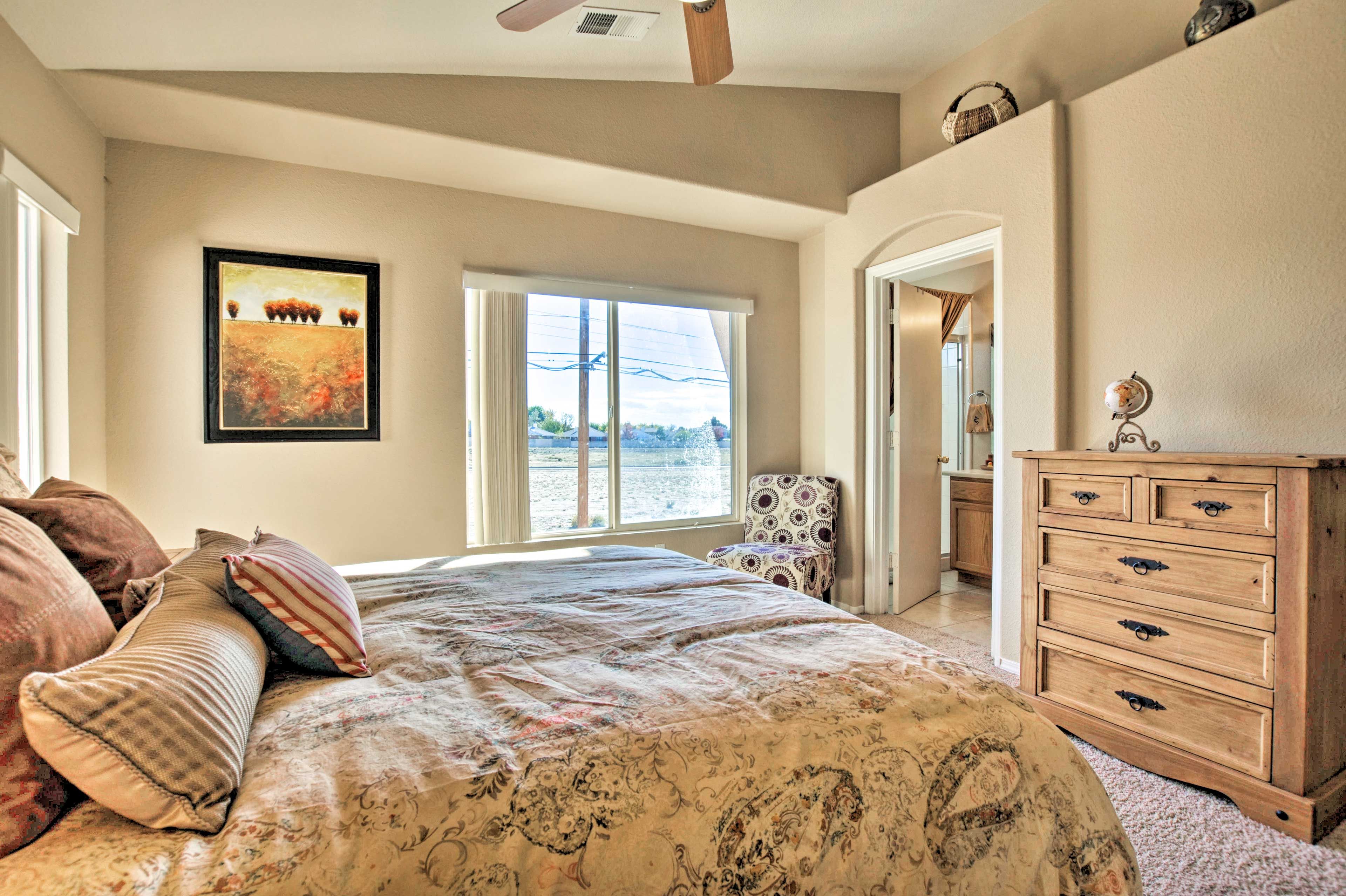 The bright & airy bedroom suite features a queen-sized bed.