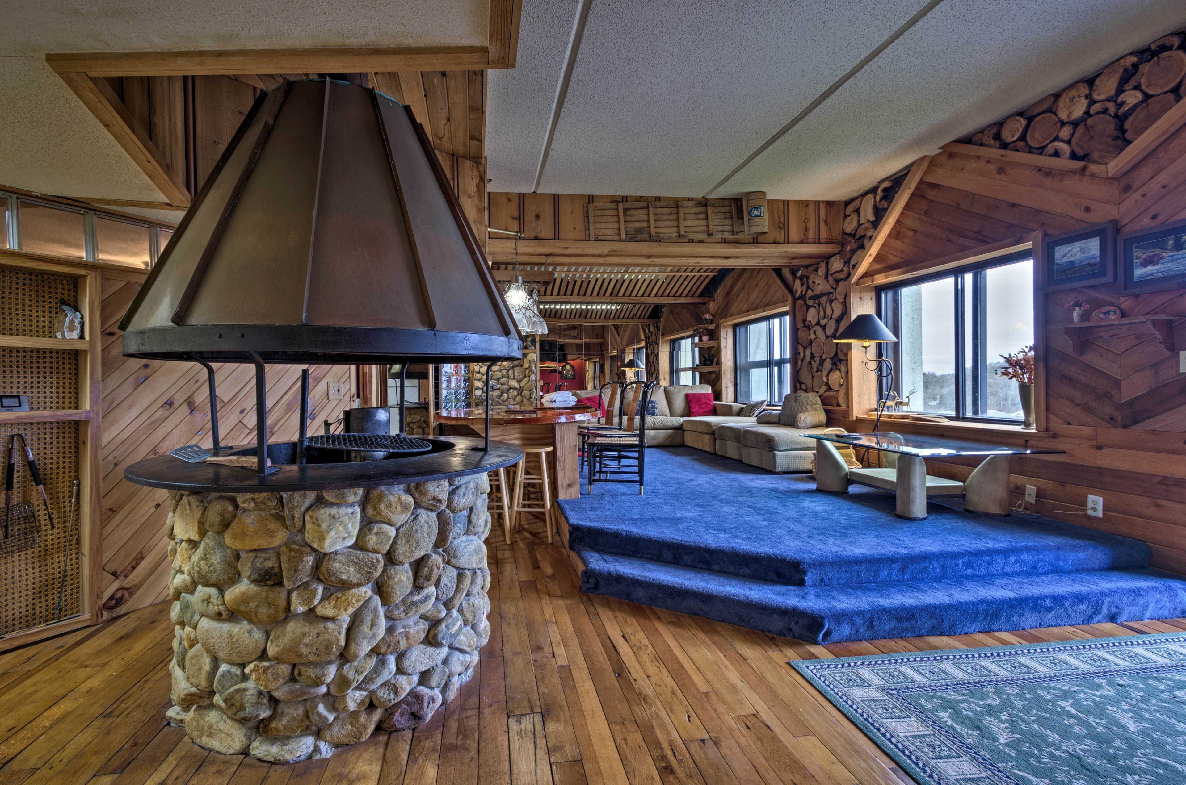 Natural wood walls and flooring bring a rustic feel to the cozy space.