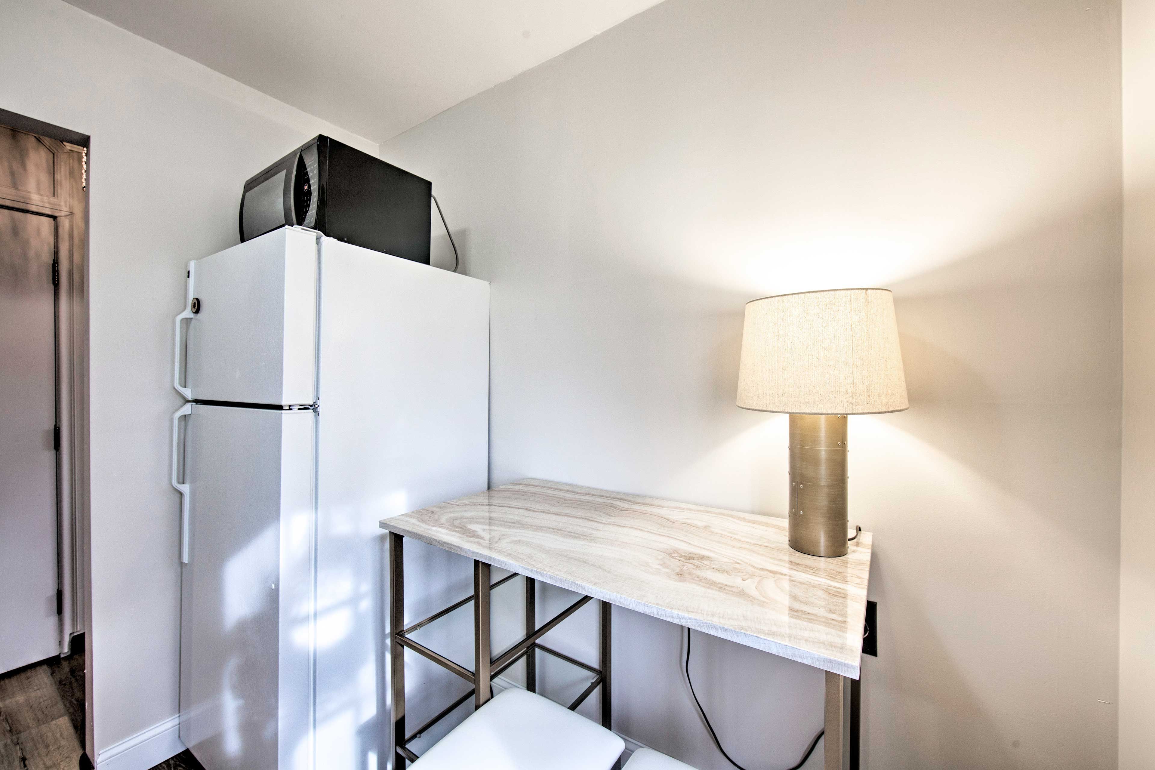 With granite countertops, the kitchen is elegant and fully equipped.