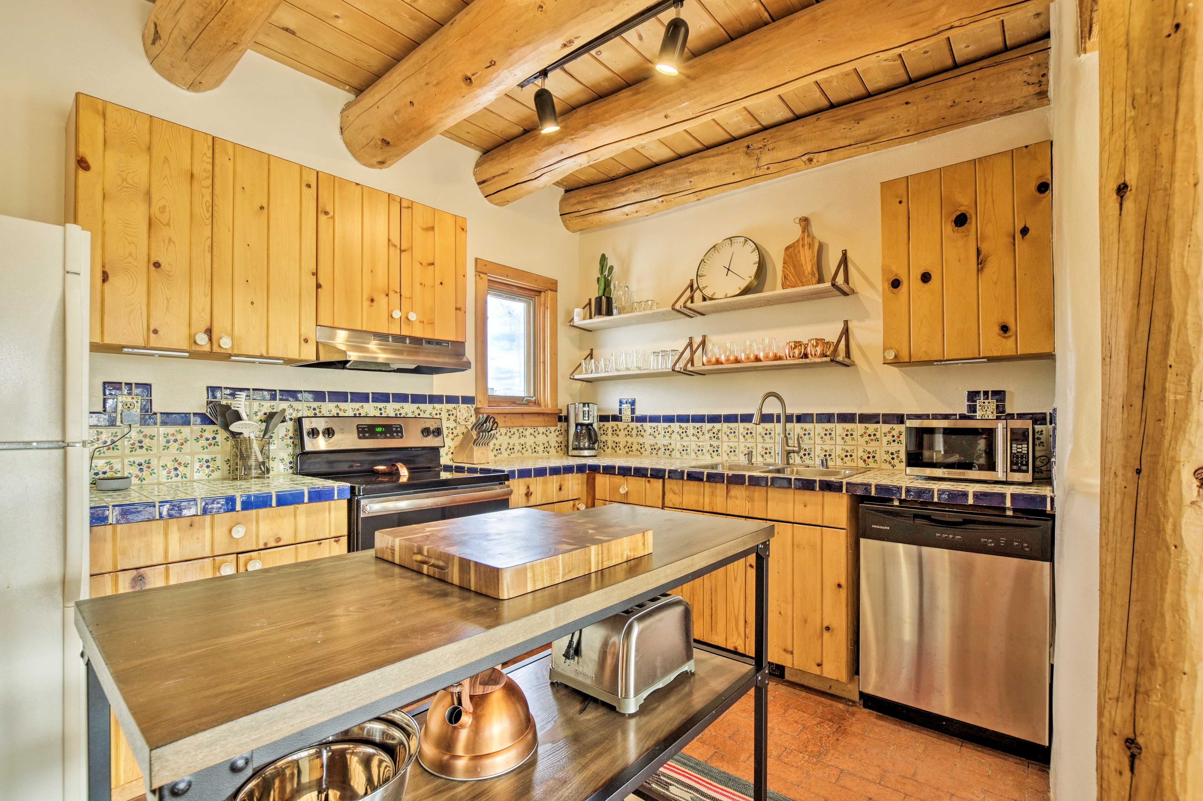 The kitchen comes fully equipped with stainless steel appliances.