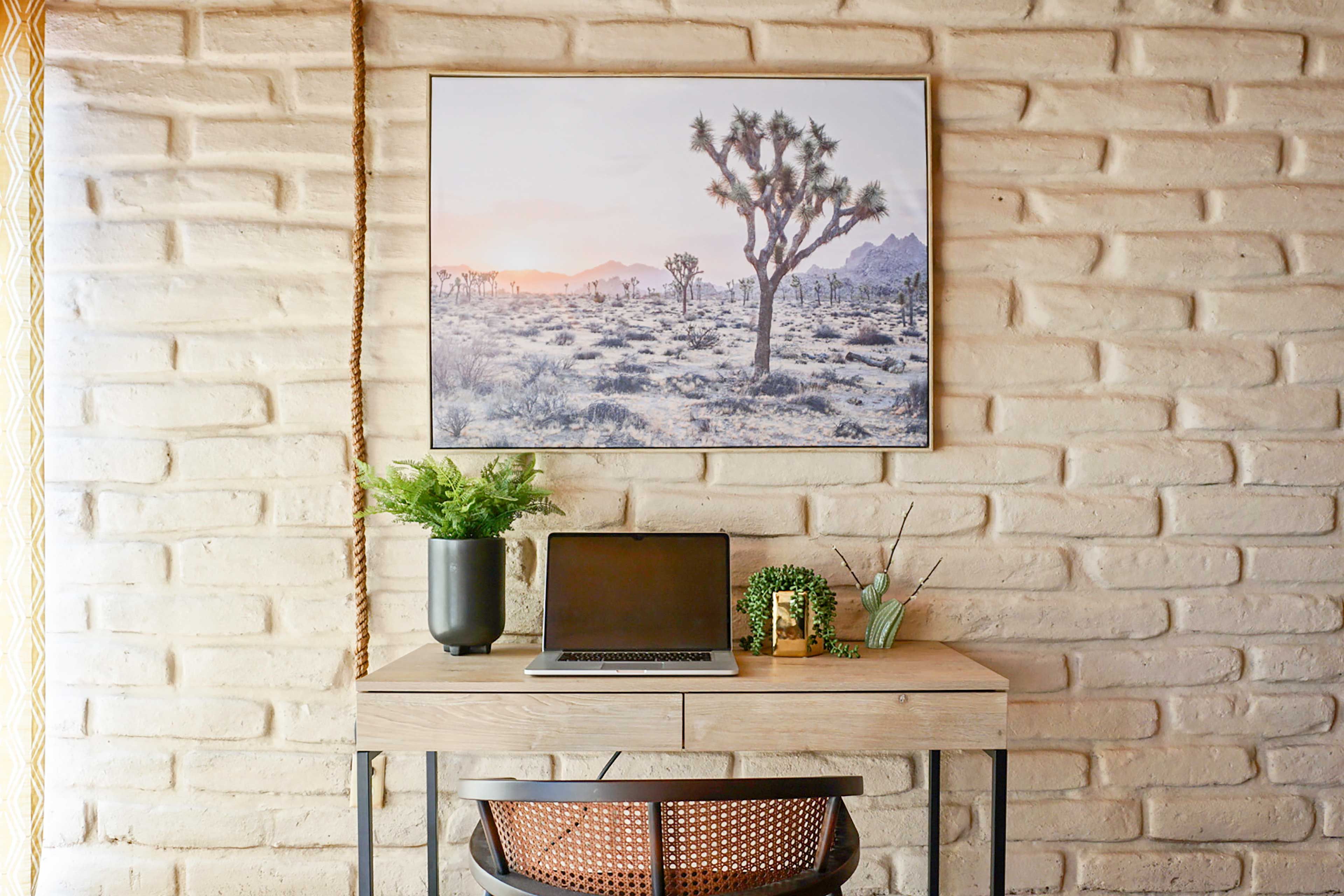 Get your work done at the quaint desk and enjoy the artwork.