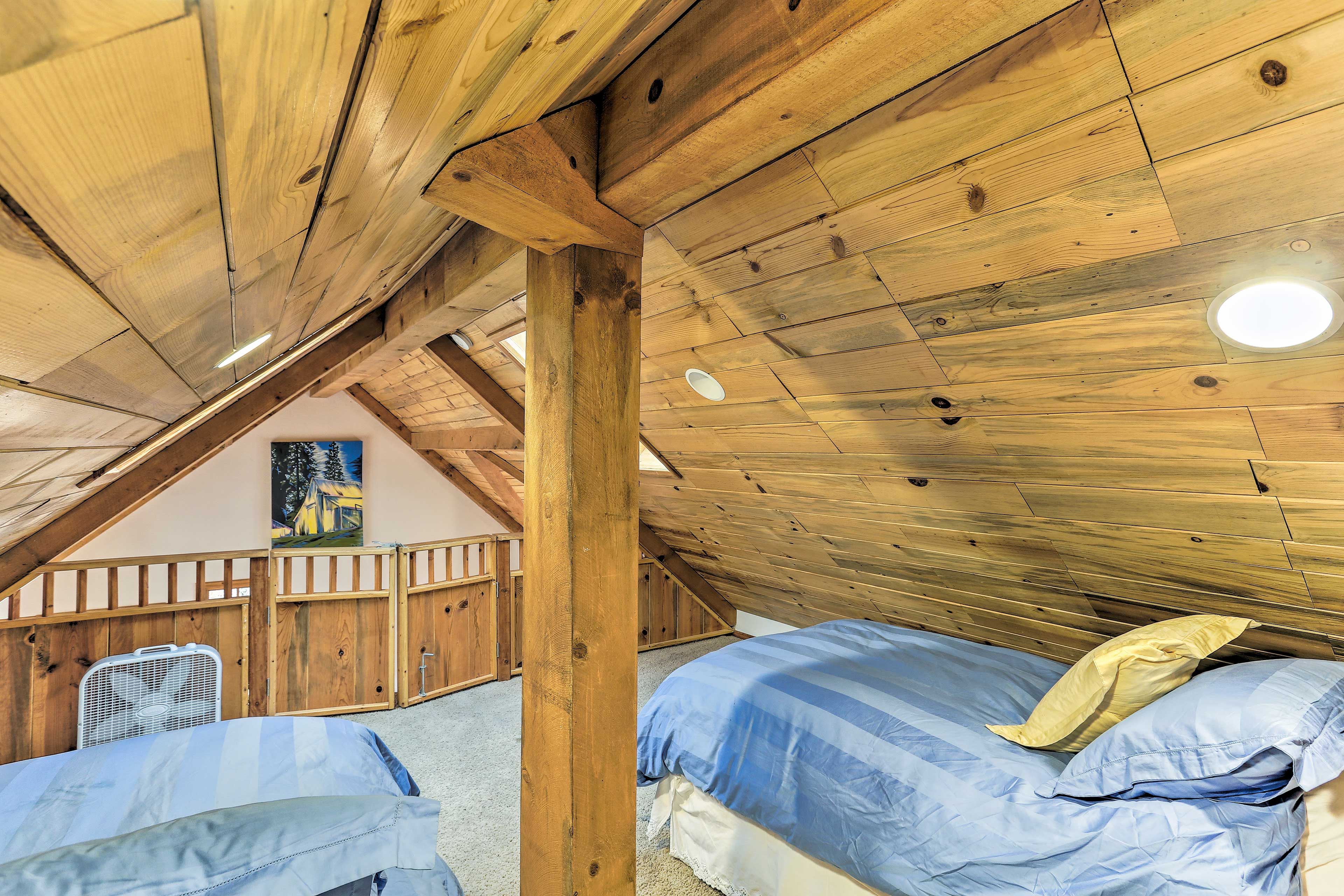 Three people can snooze in the open loft.