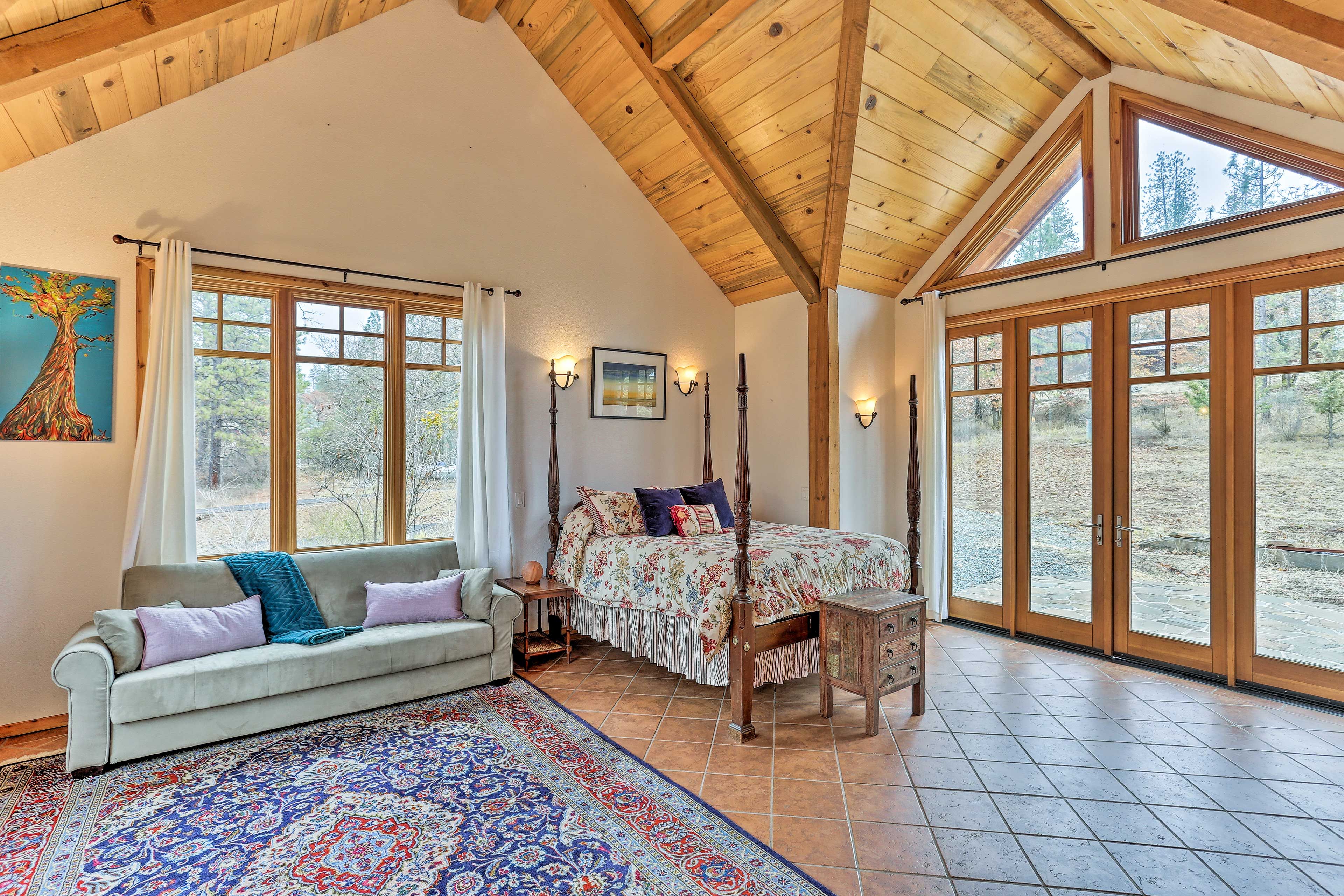 Expansive floor-to-ceiling windows & glass doors to outside allow lots of light.