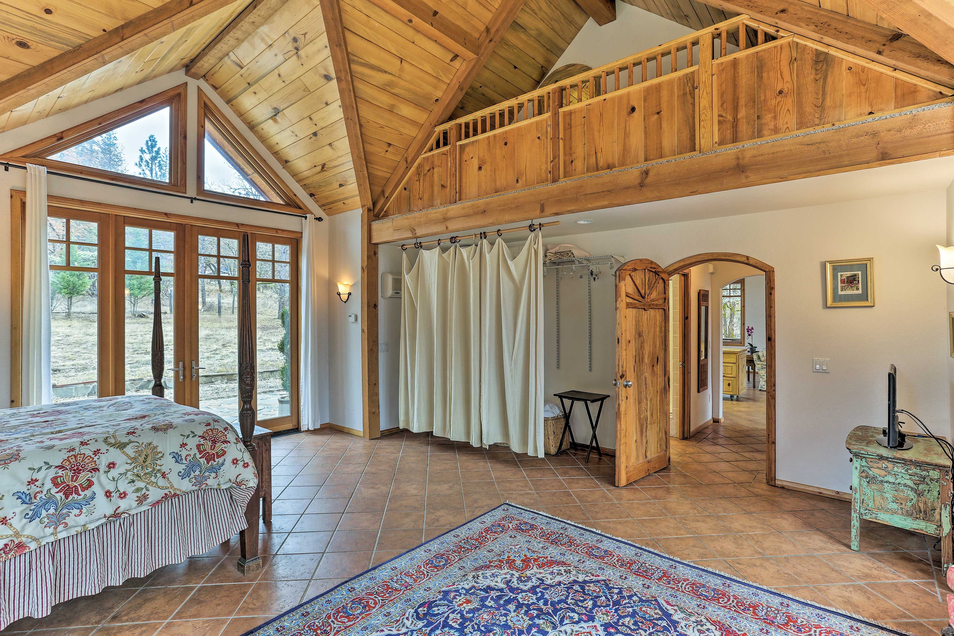 The bedroom & the living space share identical floor plans & slanted ceilings.