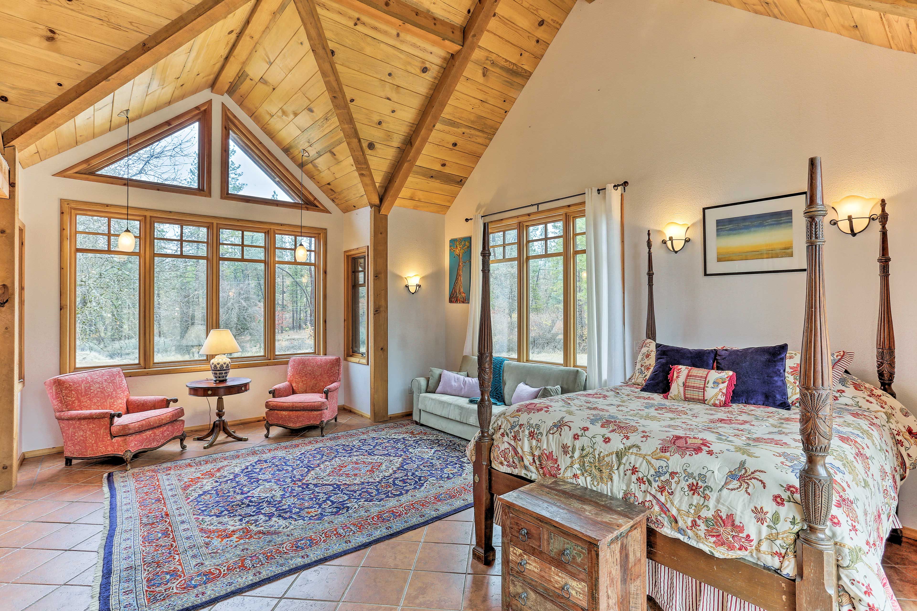 Up to 4 guests can sleep in the bedroom, between the queen bed & sleeper sofa.