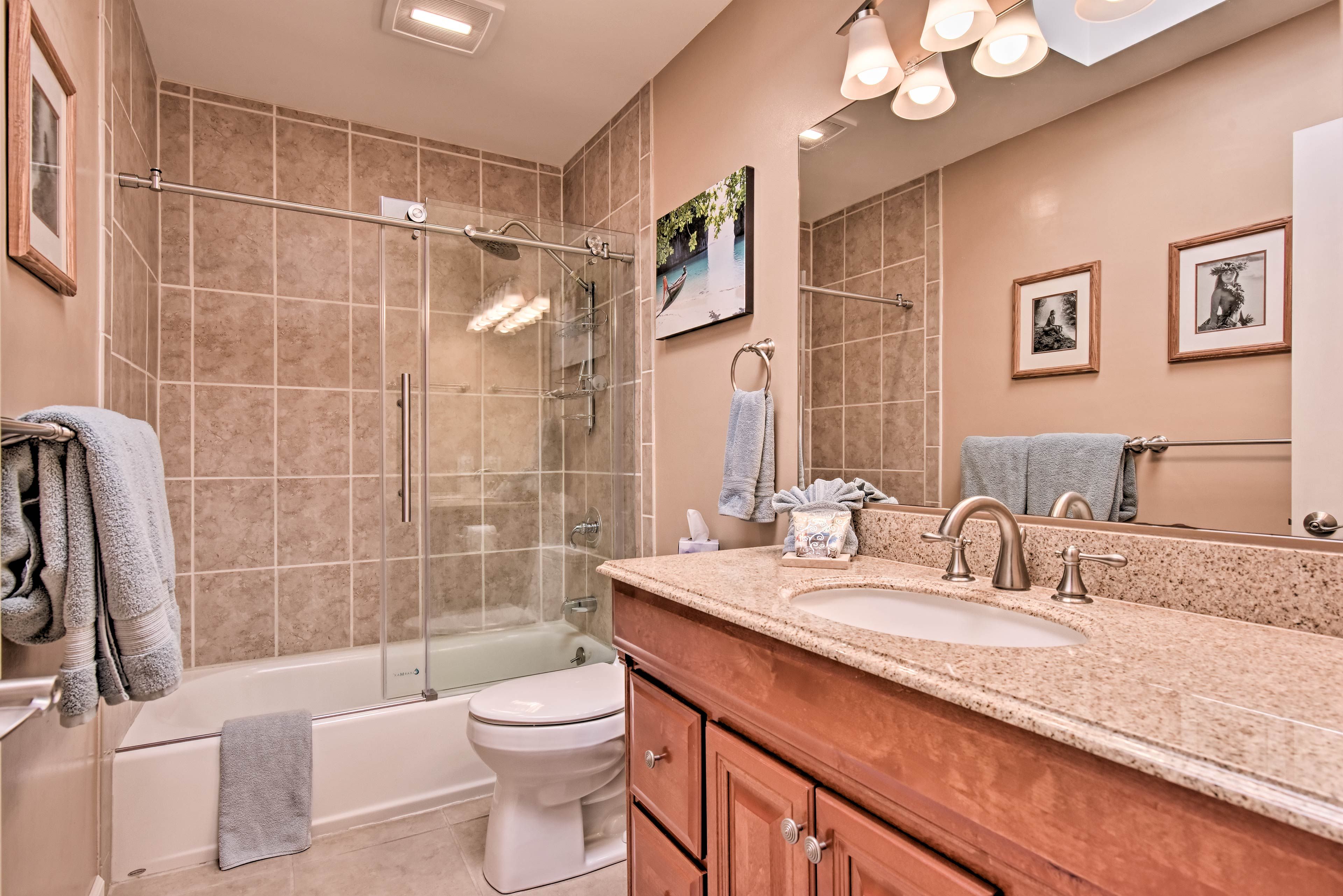 The pristine second bathroom has a shower/tub combo.