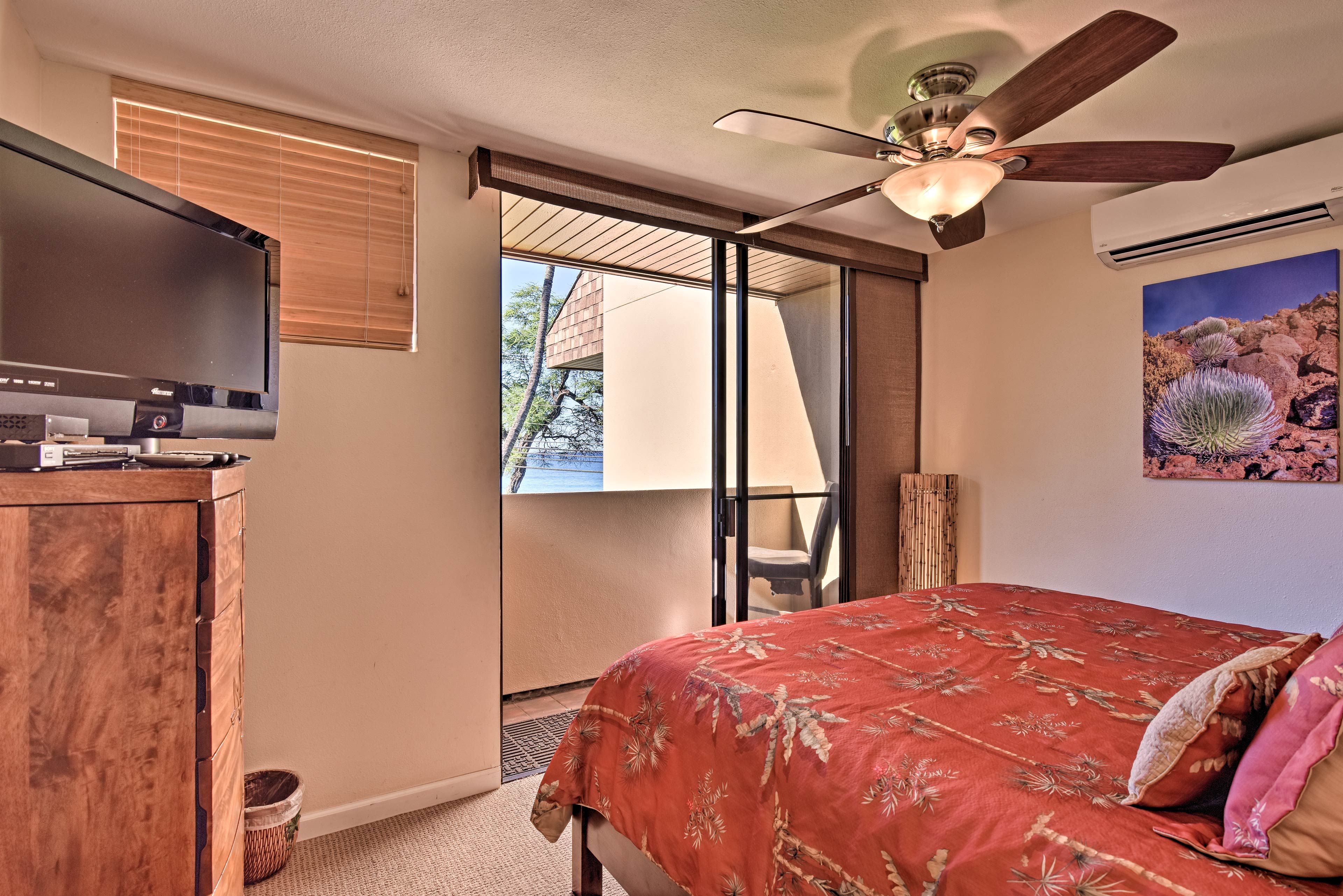 The master bedroom has a private balcony and flat-screen TV.