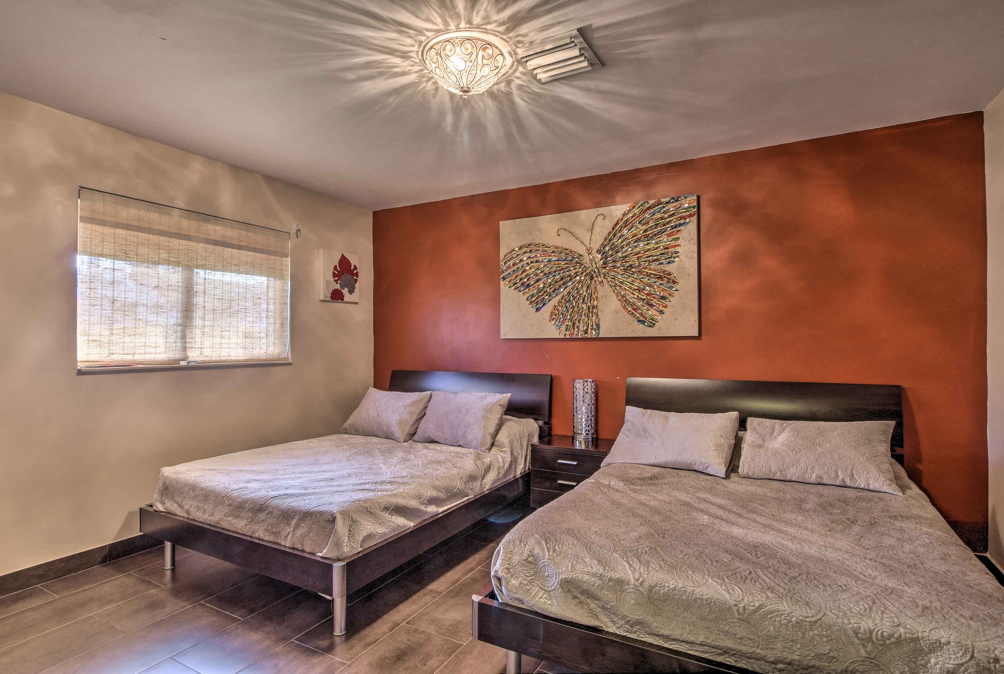 The second bedroom features 2 full-sized beds.