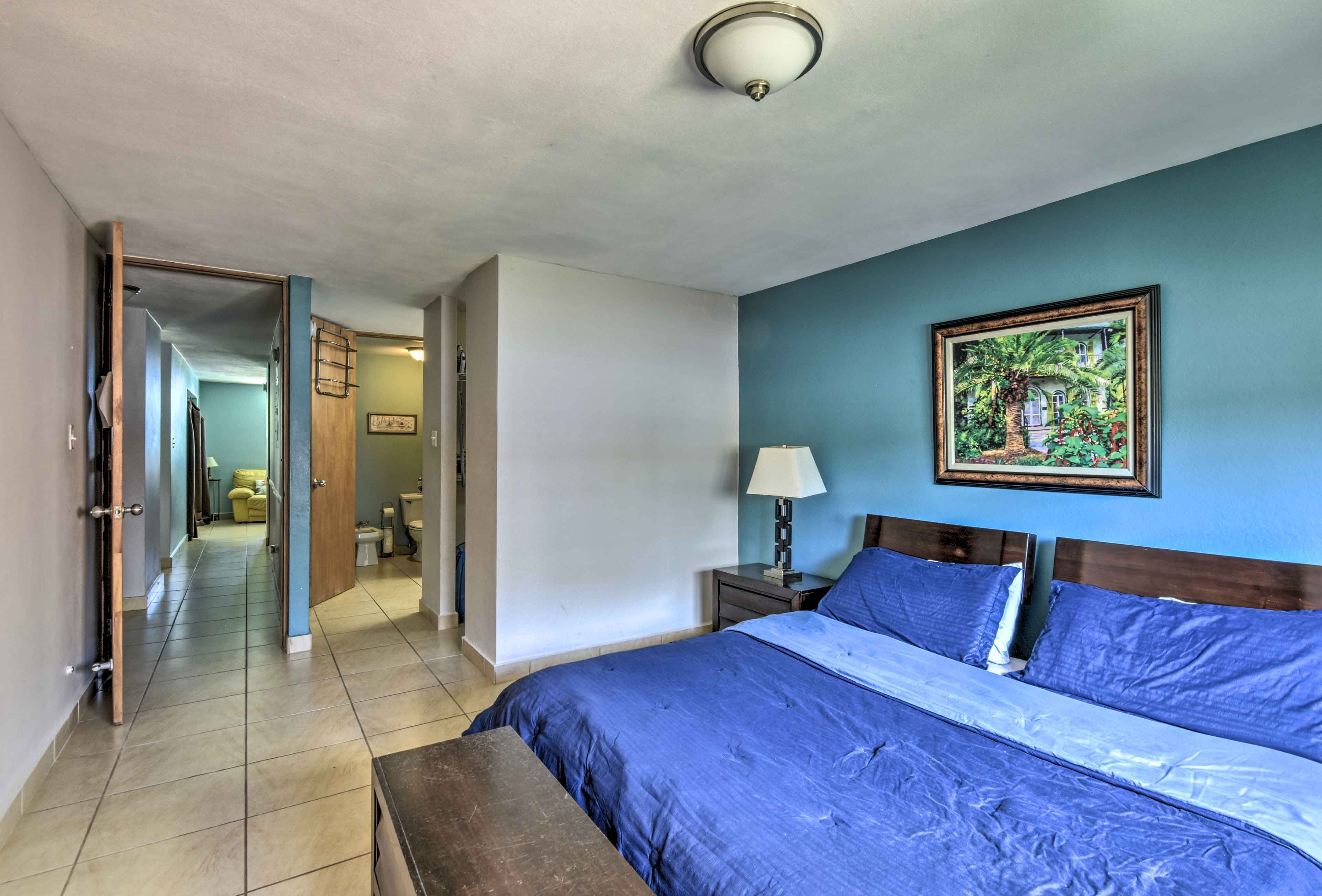 Bedroom 1 boasts a plush king-sized bed and an en-suite bathroom.