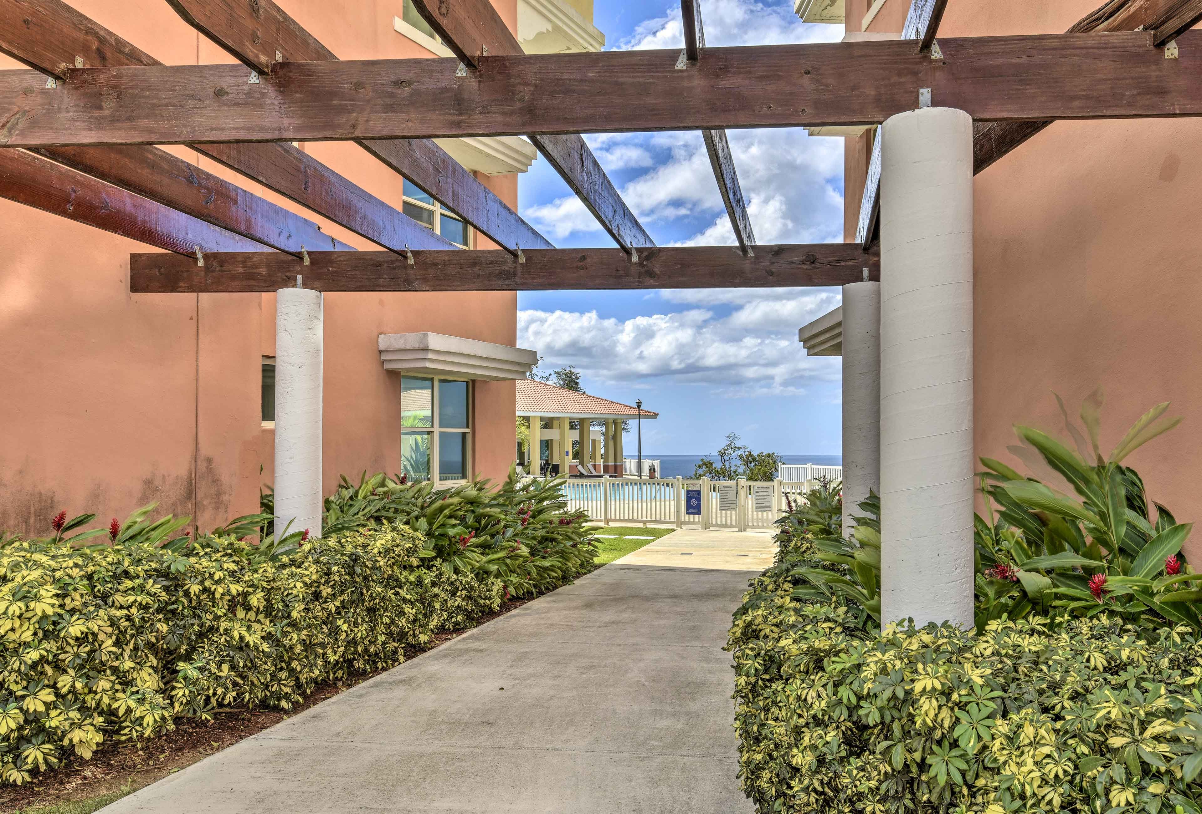 Green gardens and palm trees frame your oceanfront resort.