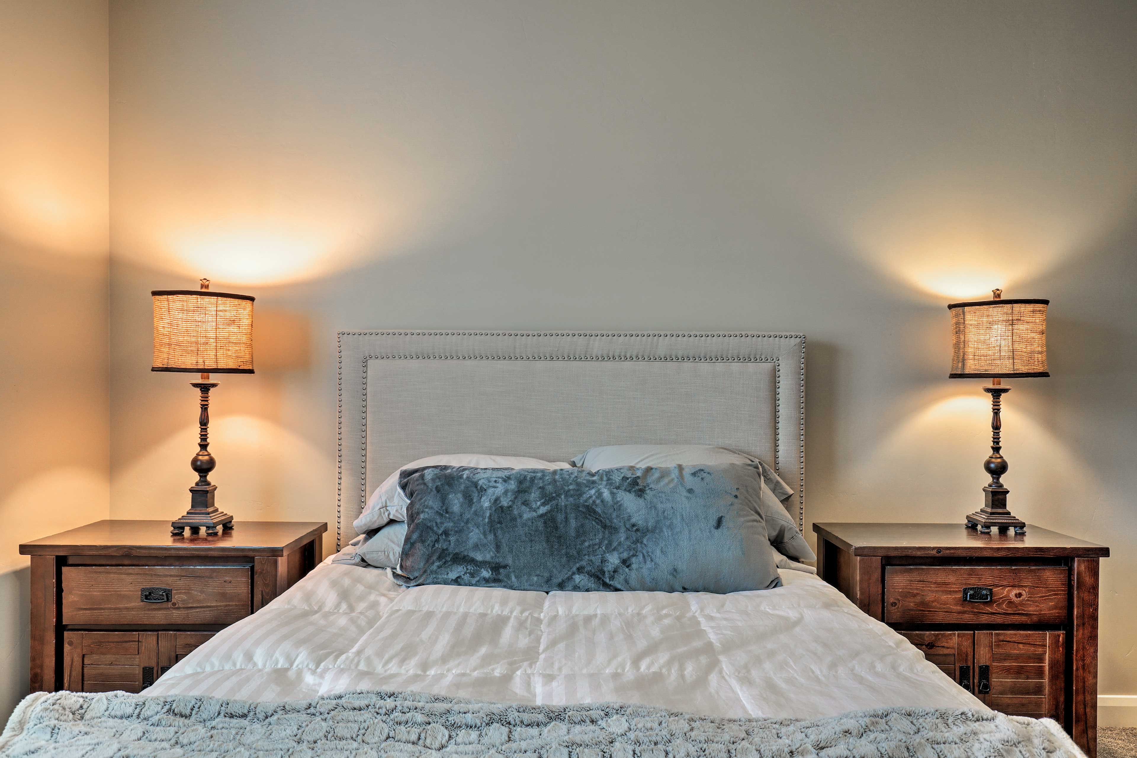 Curl up under the covers  in this queen bed.