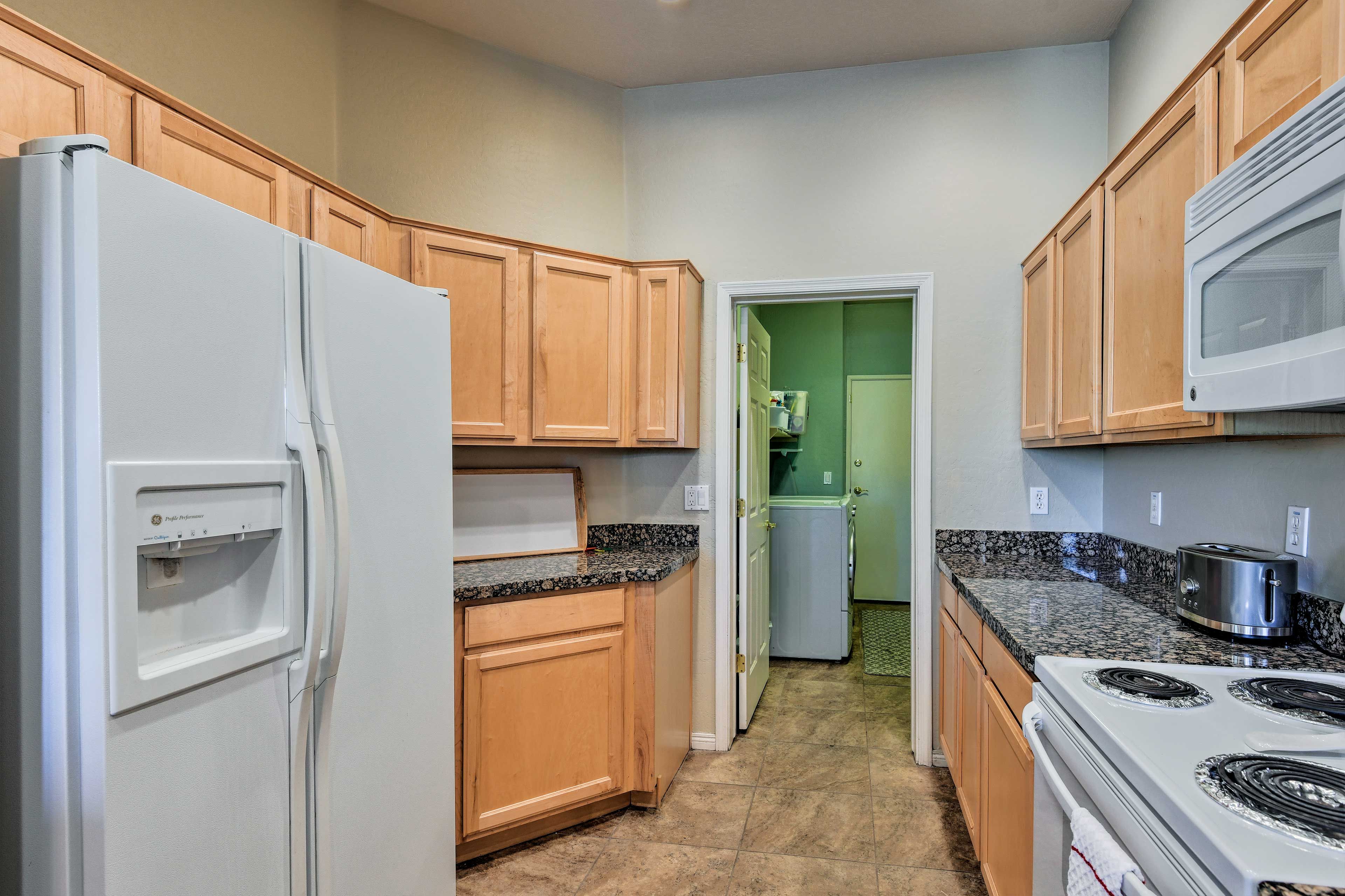 A fully equipped kitchen invites you to whip up your favorite dish!
