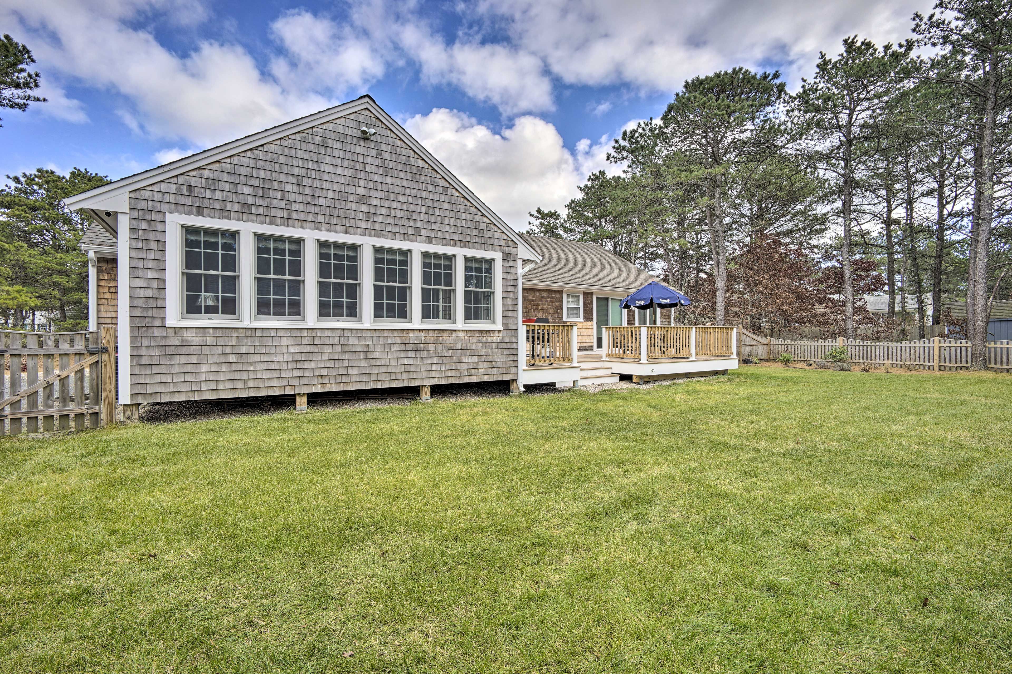 Fully fenced and landscaped, the backyard is perfect for leisurely afternoons.
