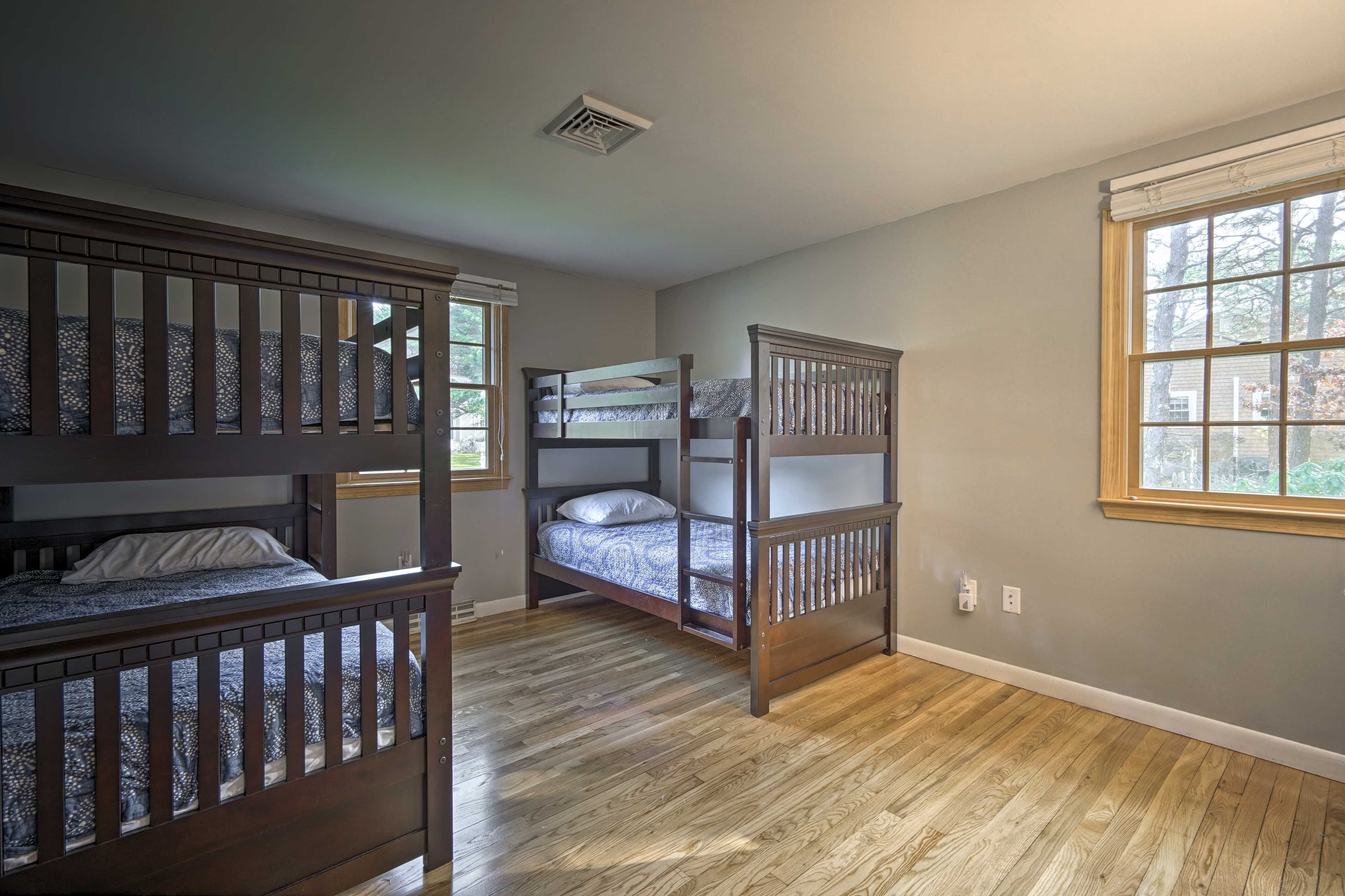 Kids will be quick to claim one of the top bunks in this guest bedroom!