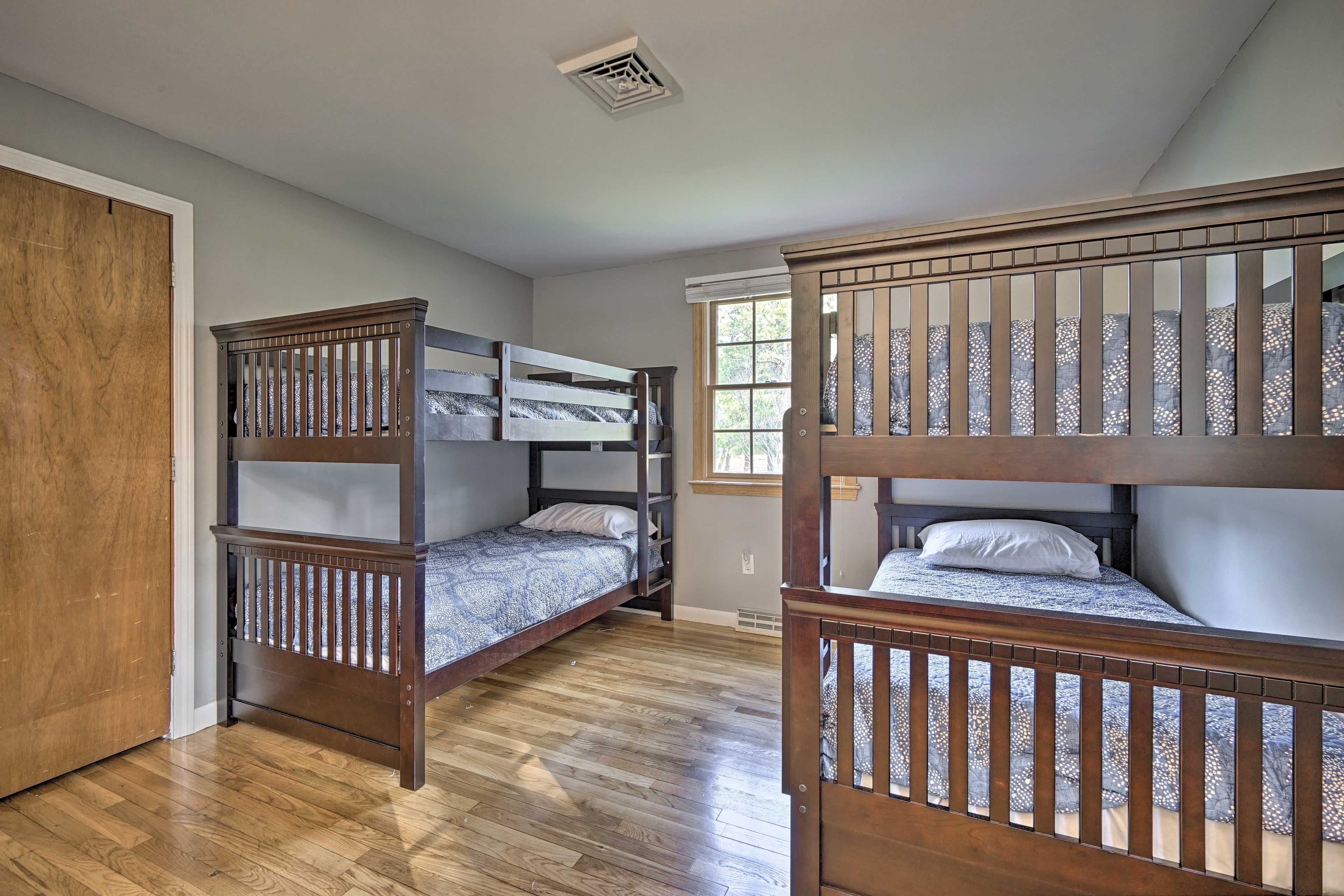 The room features 2 twin bunk beds.