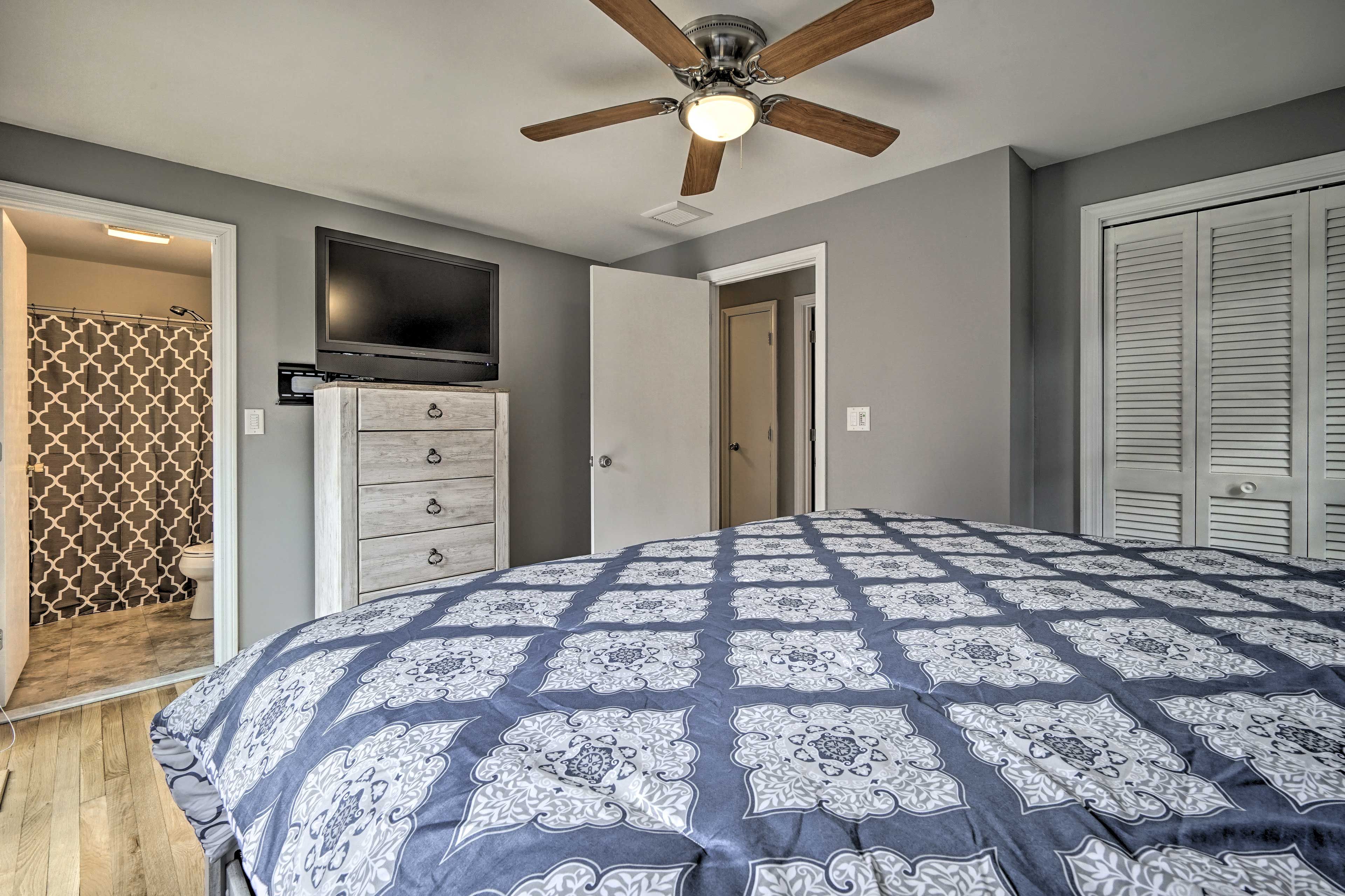 Cozy up under the covers as you surf the channels on the flat-screen TV.