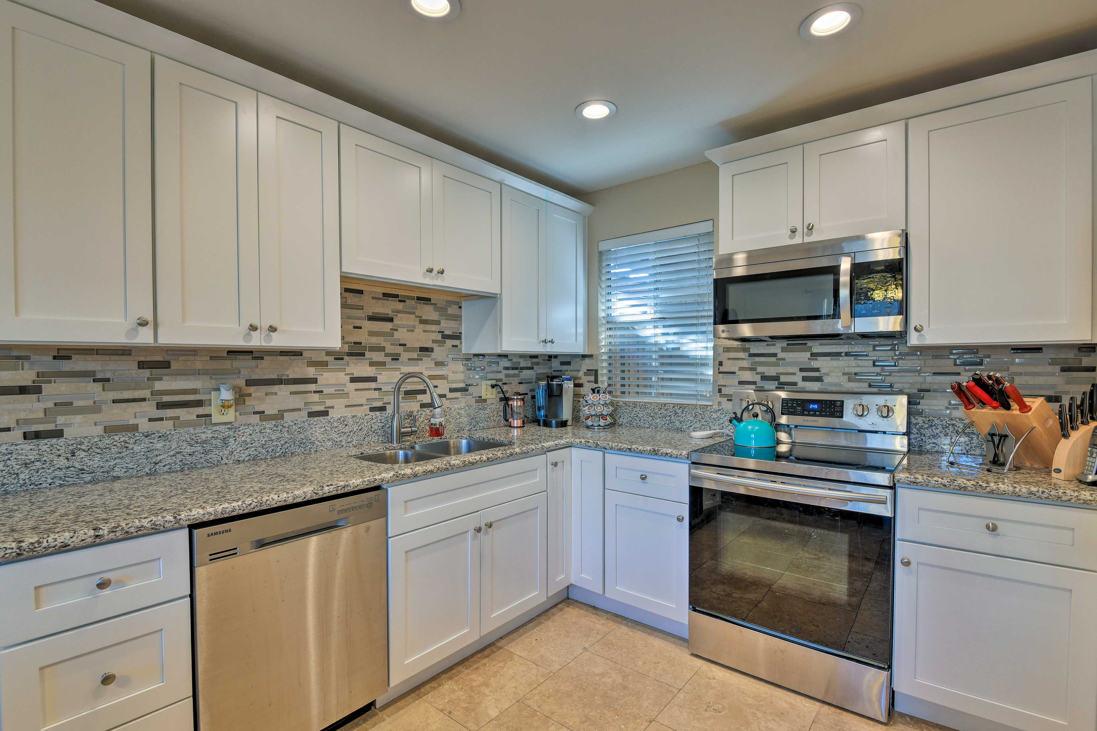 Stainless steel appliances and ample cookware promise easy home-cooking.