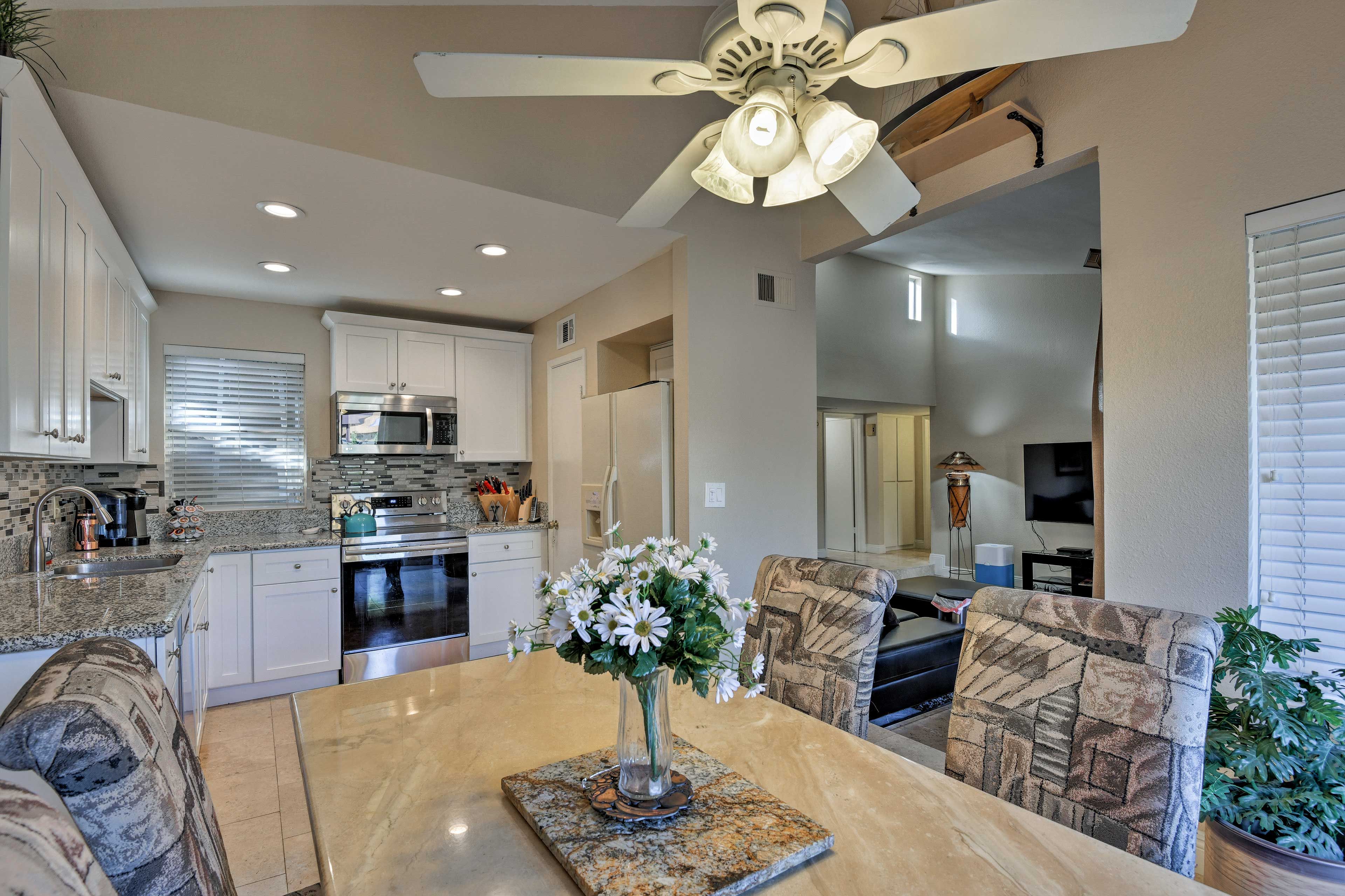 Through the open doorway, you'll find the dining area and kitchen.
