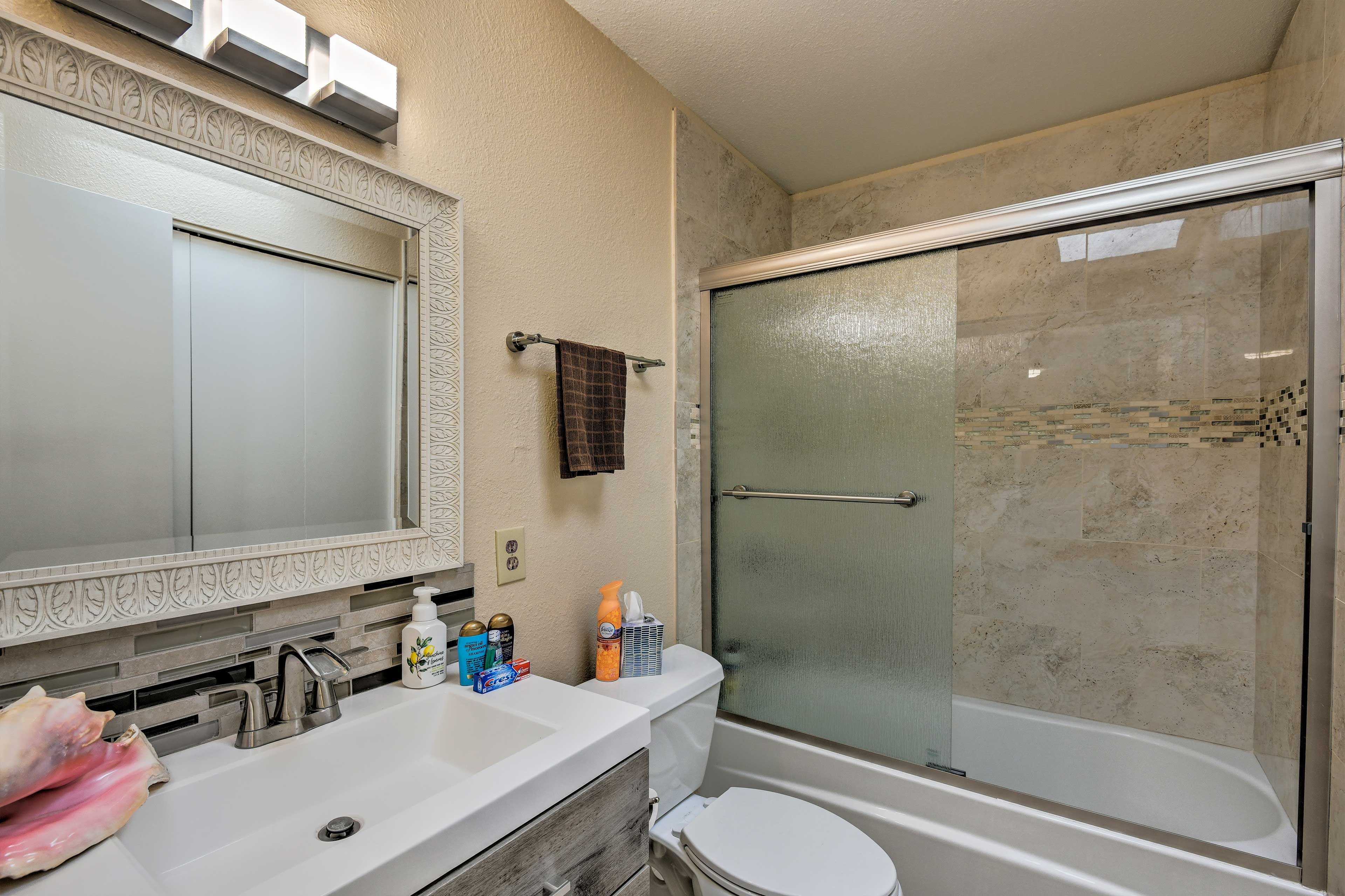 Both full bathrooms come stocked with fresh towels.