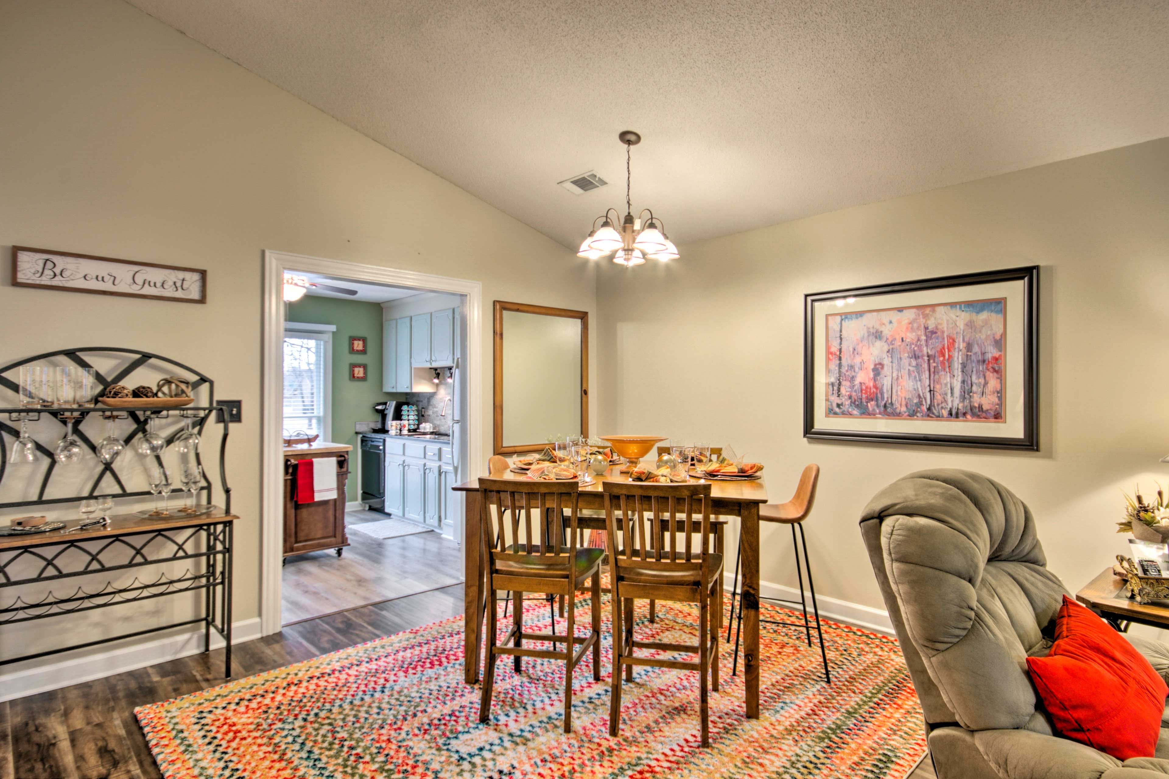 Enjoy meals gathered around the high wooden dining table.
