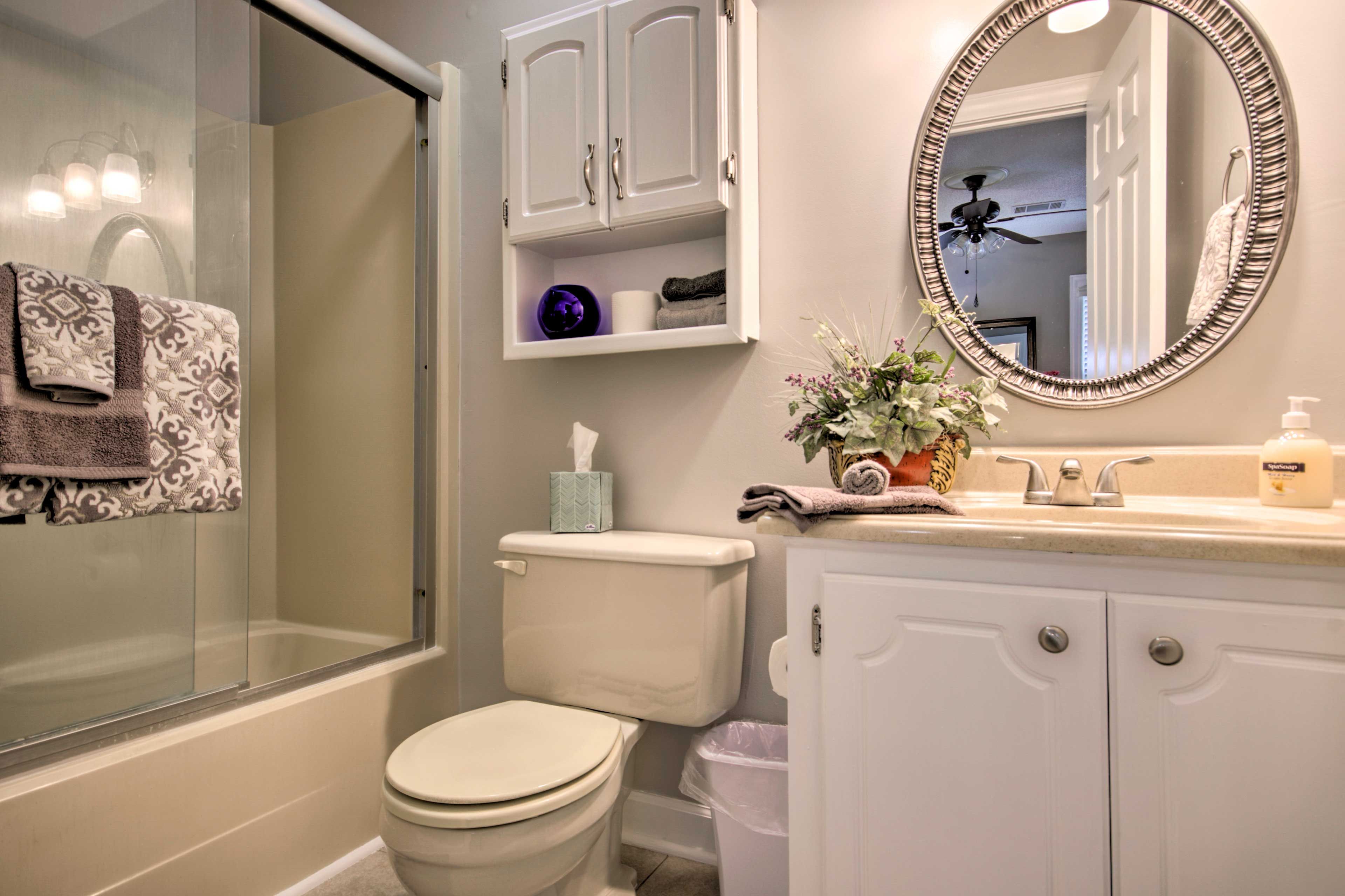 Each bathroom features a shower/tub combo.