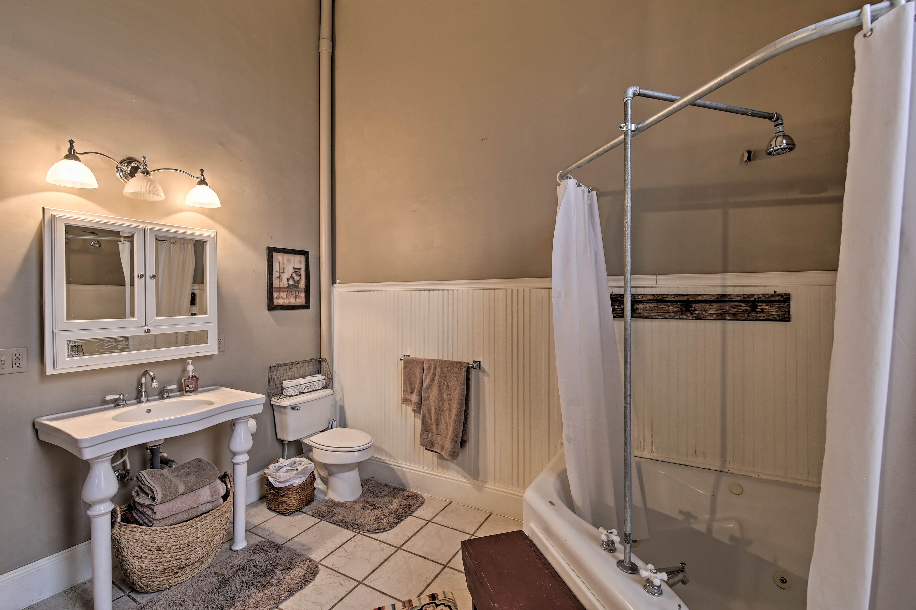 The full bathroom offers a shower/tub combo with a Whirlpool tub.