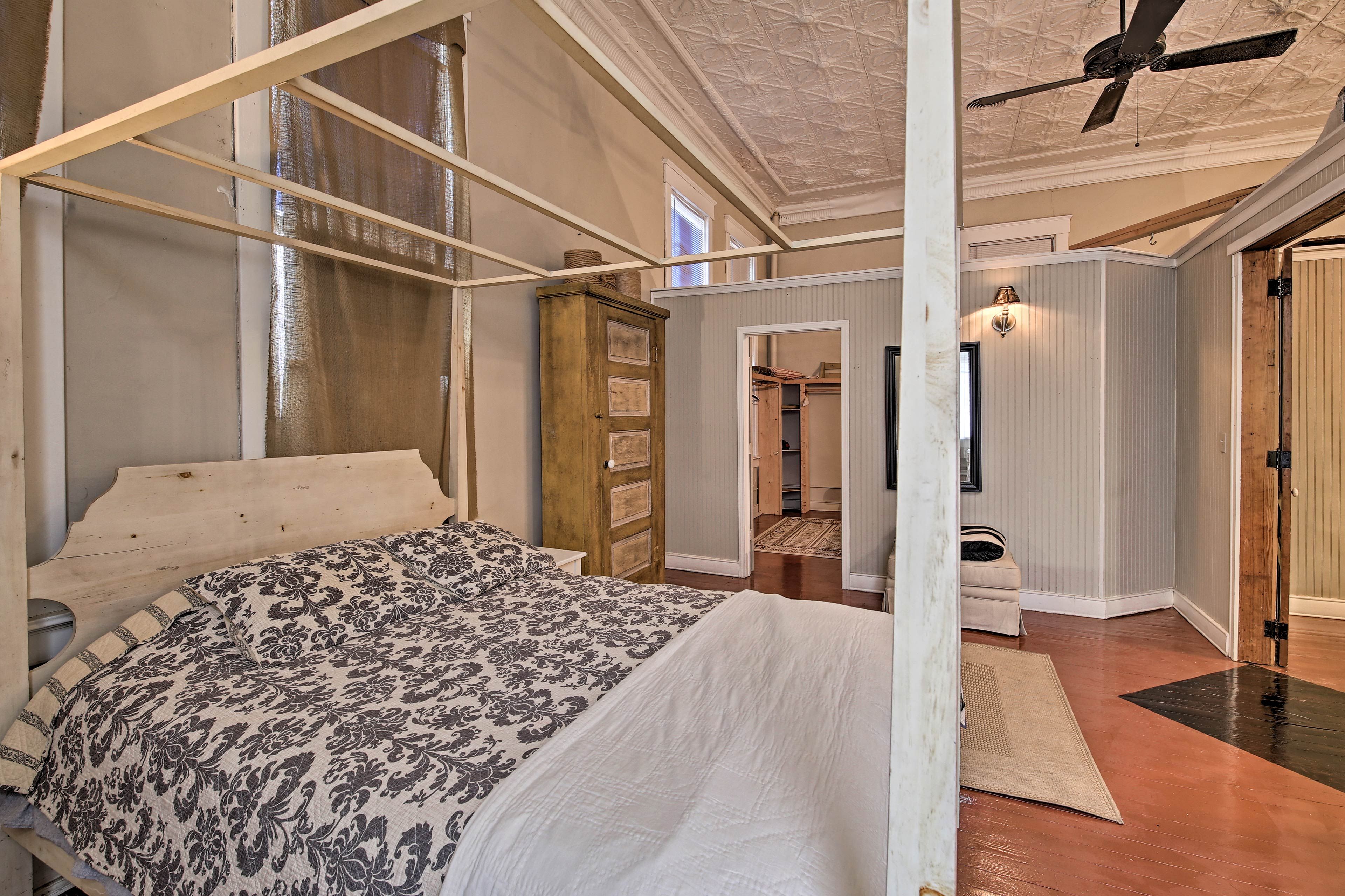 Climb under the covers of the queen-sized bed.