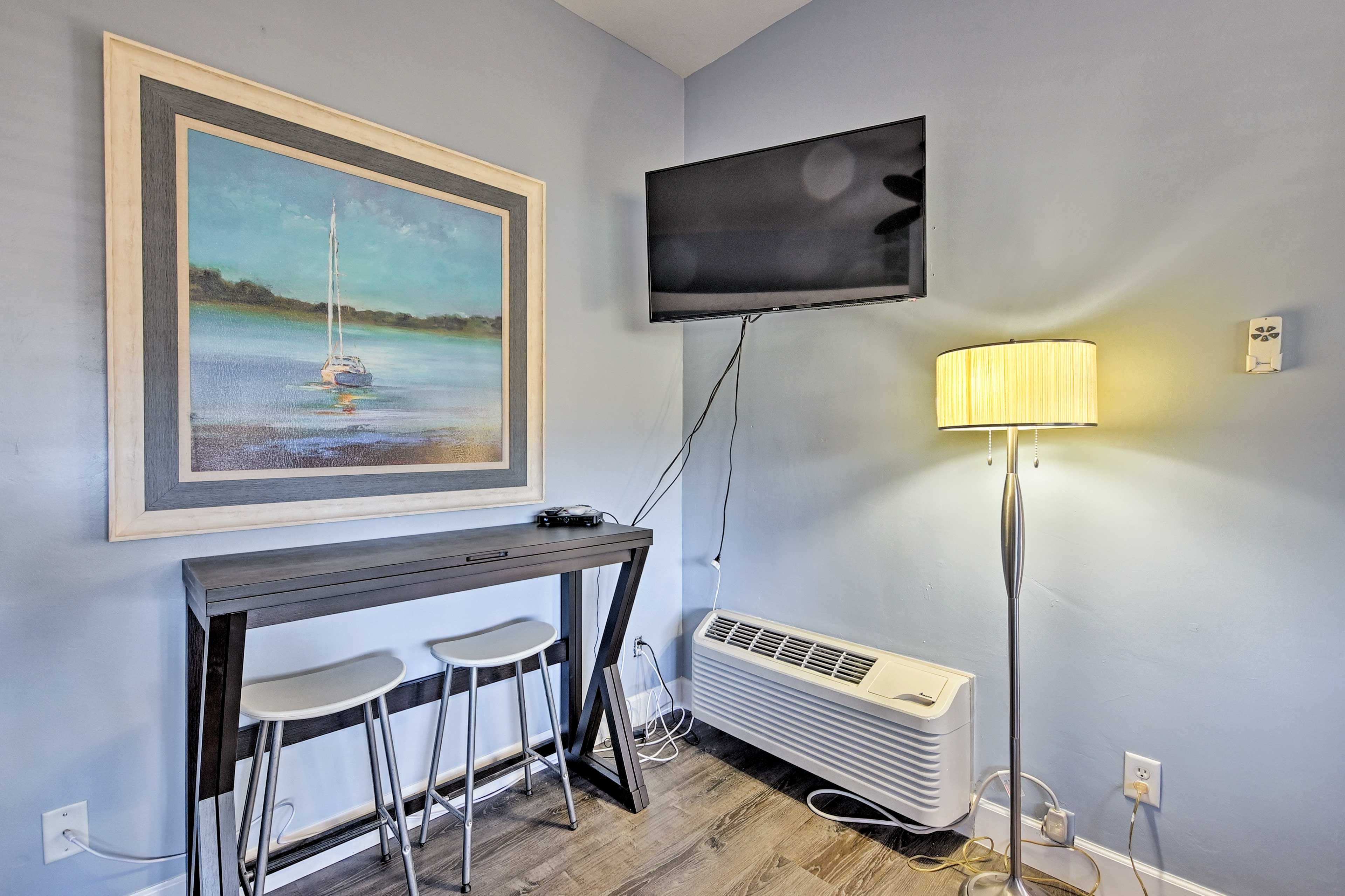 Watch your favorite shows or movies on the flat-screen TV.