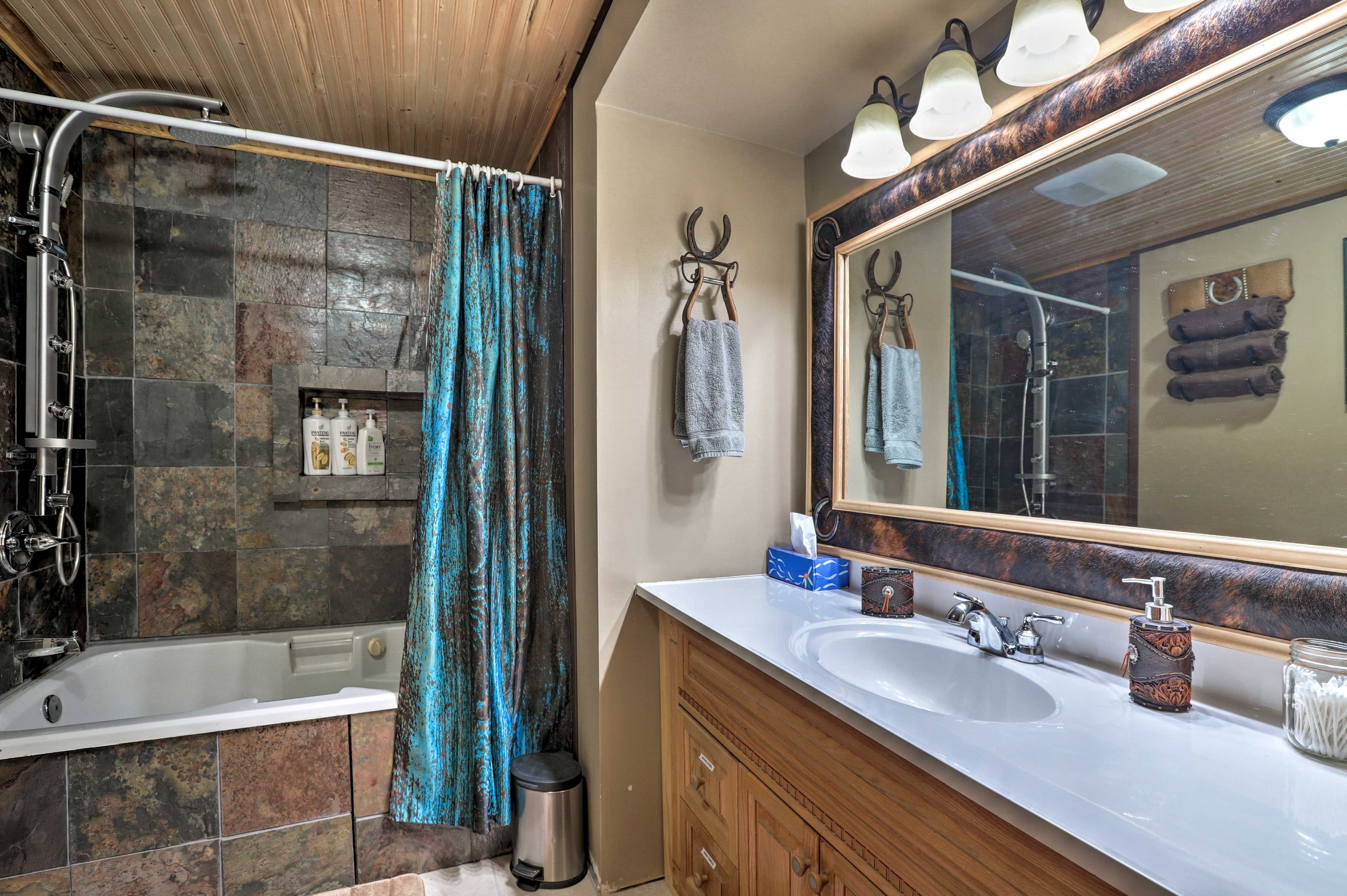 Rinse off in the full bathroom with a shower/tub combo.