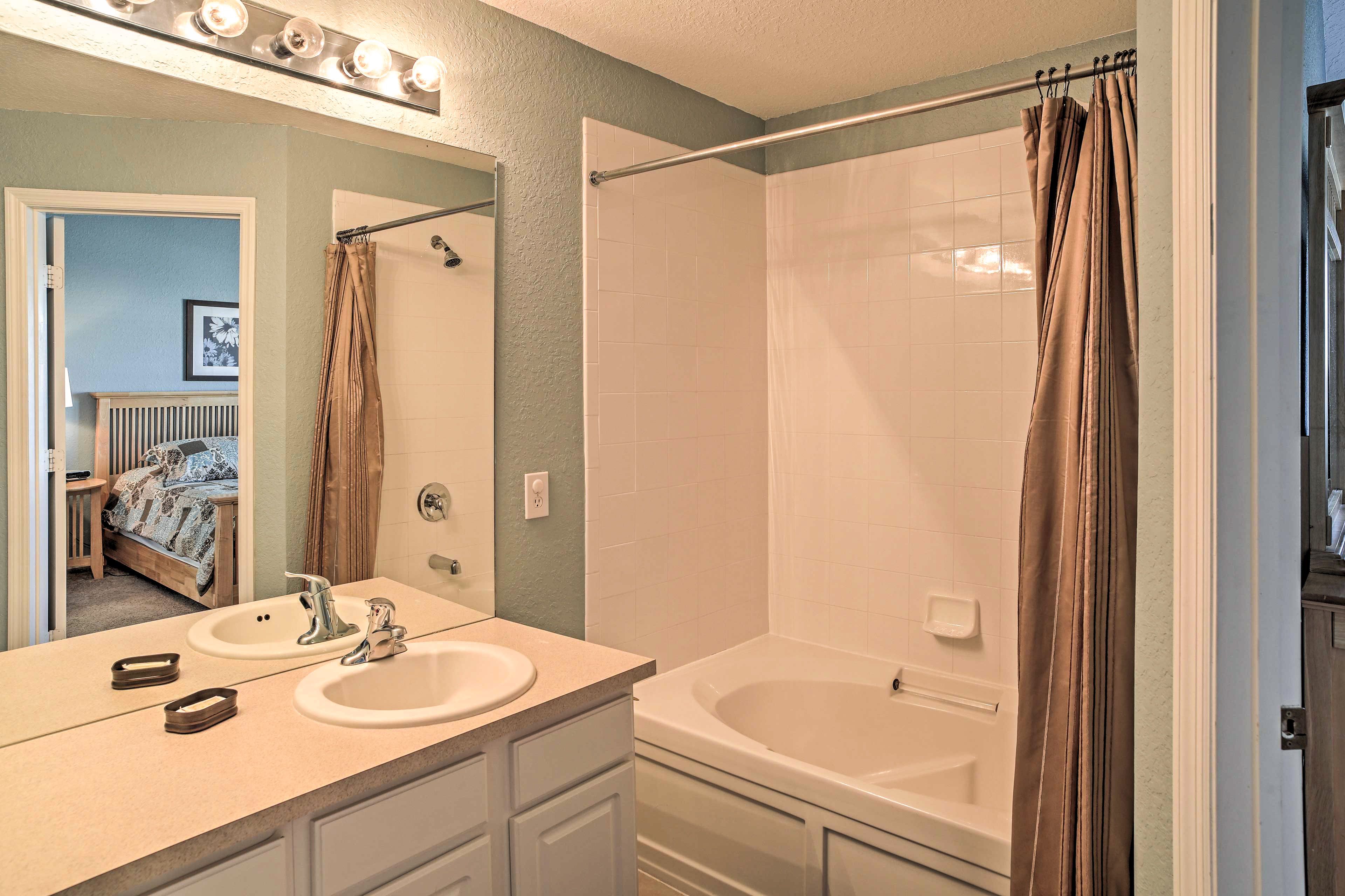 The en-suite bathroom offers a shower/tub combo.