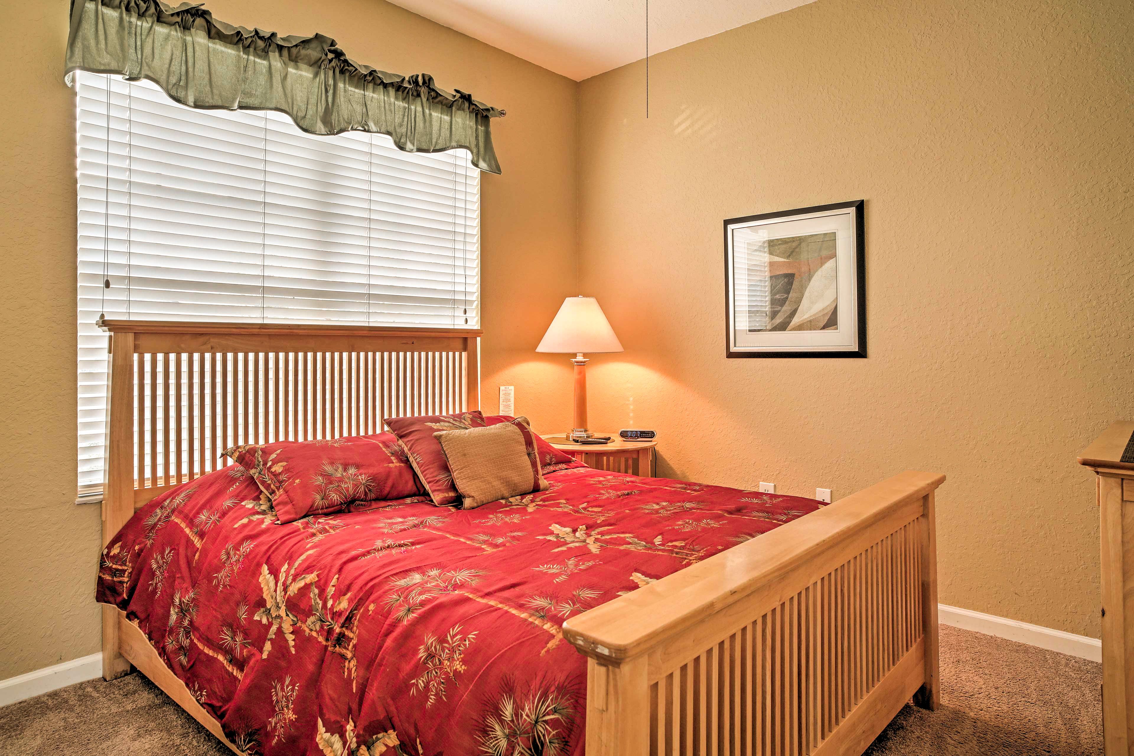 Two more guests can rest on this queen-sized bed.
