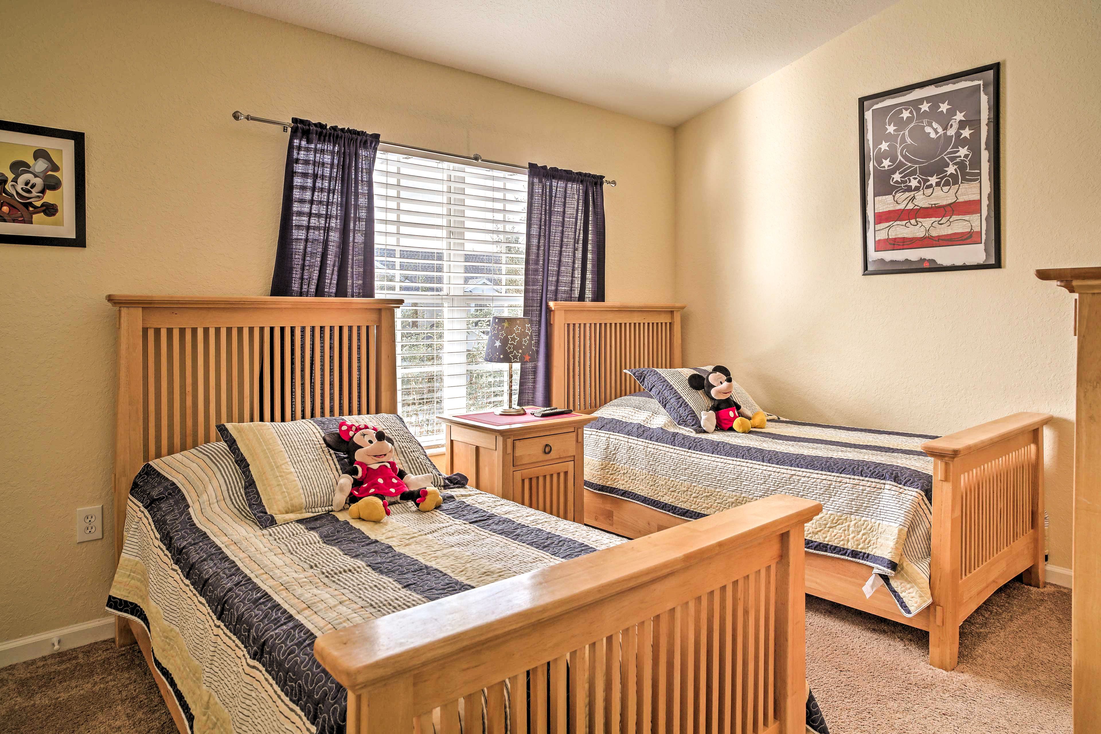 Kids will love the Mickey Mouse-themed room with 2 twin beds.