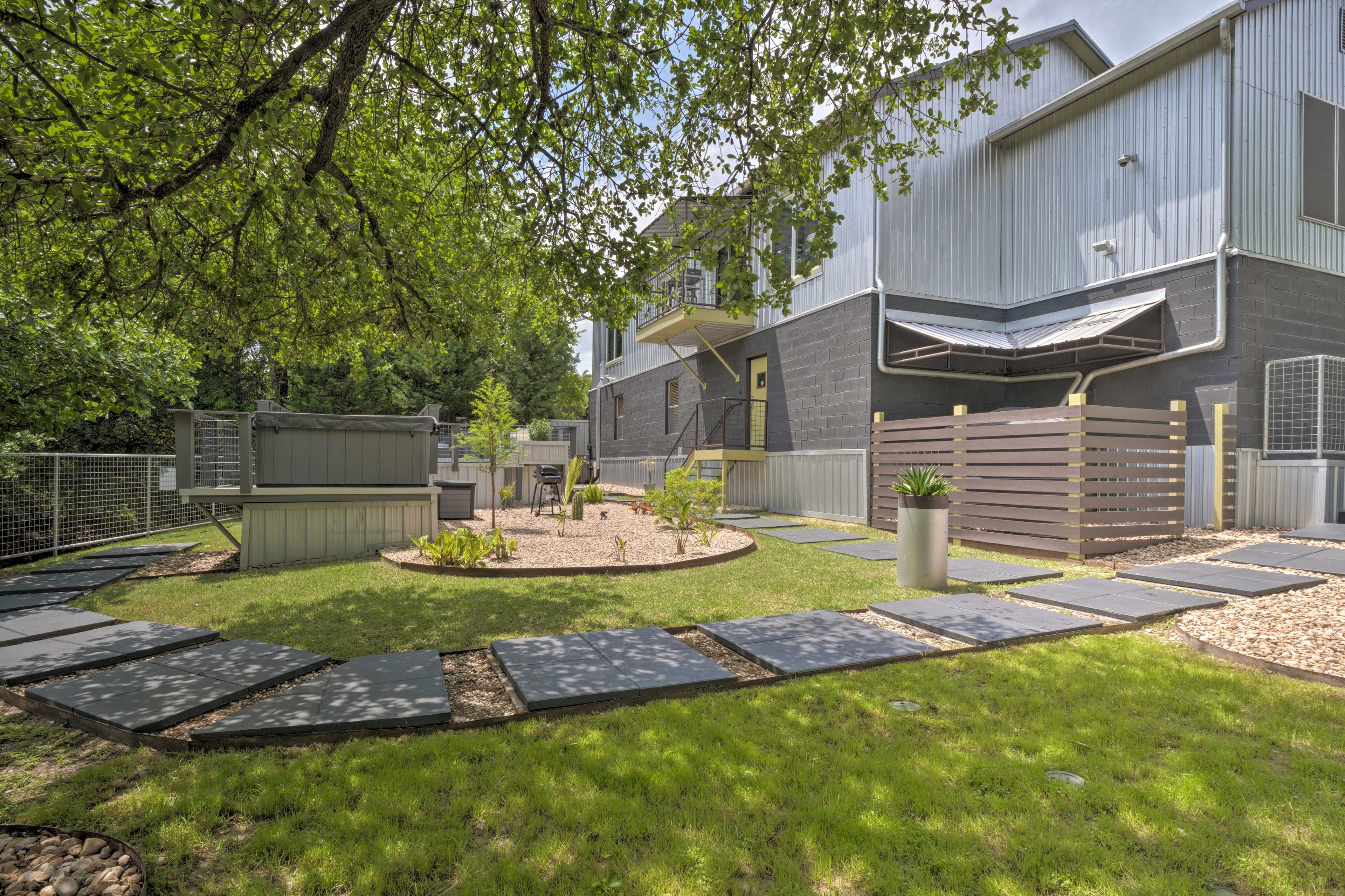 The landscaped yard is perfect to hang out in on a cool day.