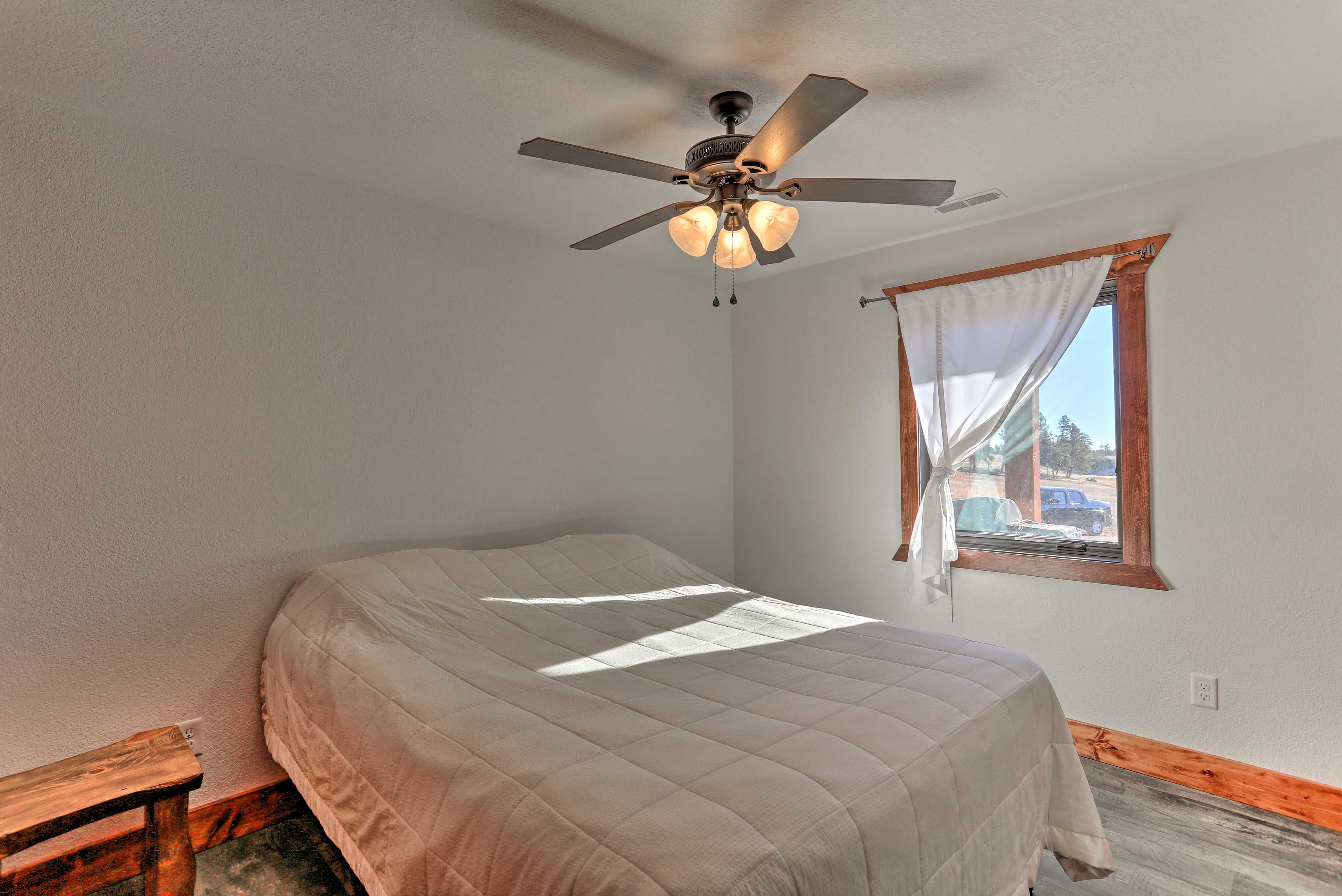 Cozy up on this queen bed for a full night's sleep.
